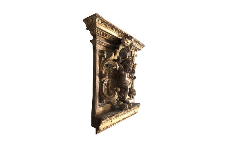 An outstanding and exquisite 17th century French capital to a pilaster. Expertly carved from wood with a wonderful cherub stunningly finished in water gilding and polychrome. A exceptional architectural piece ready to incorporate into other