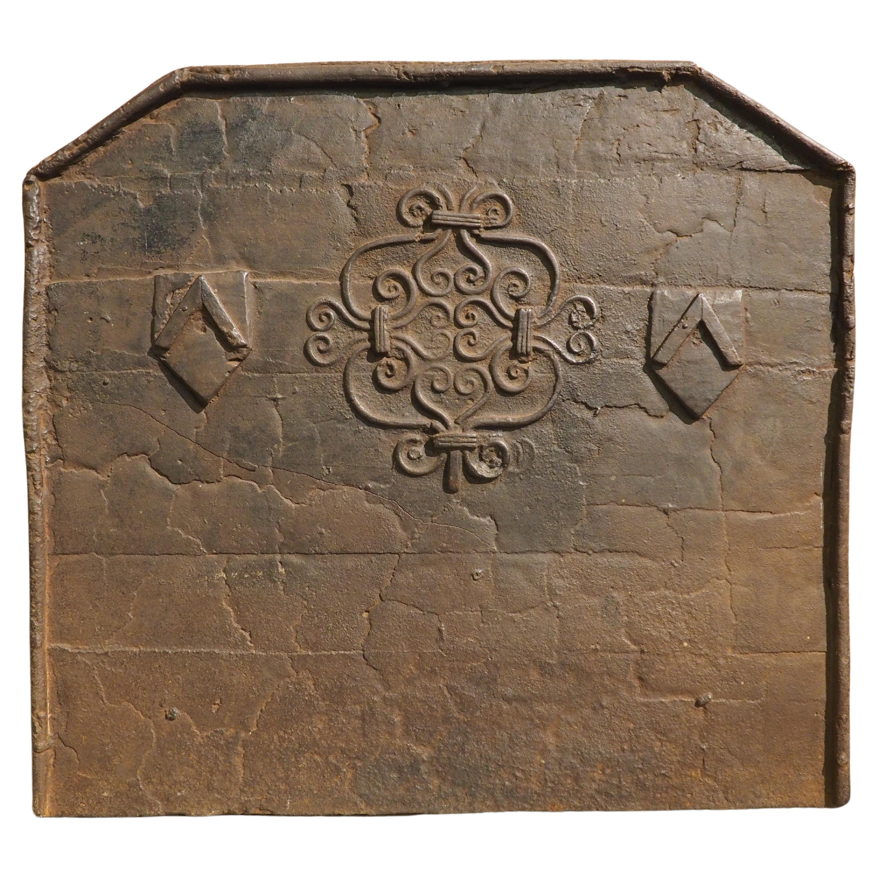 17th Century French Cast Iron Fireback with Scrolled Motifs and Double Chevrons