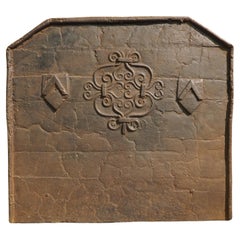 17th Century French Cast Iron Fireback with Scrolled Motifs and Double Chevrons
