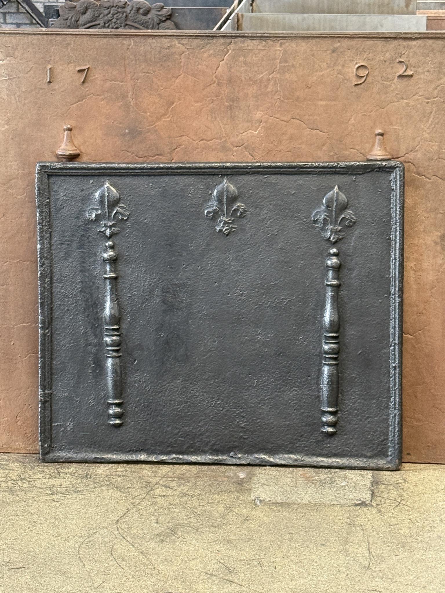 17th century French Louis XV Period fireback with pillars and Fleurs de Lys. The Fleurs de Lys (lilies) were partially truncated after the French Revolution as Fleurs de Lys symbolized royalty and aristocracy throughout Europe. The pillars stand for