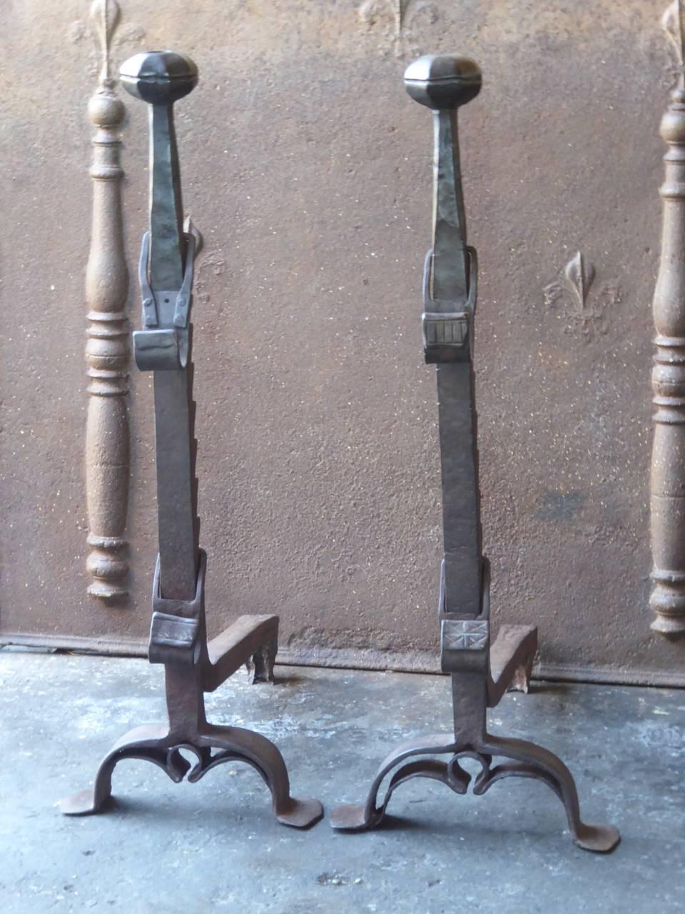 17th century French Gothic andirons made of wrought iron. These French andirons are called 'landiers' in France. This dates from the times the andirons were the main cooking equipment in the house. They had spit hooks to grill meat or poultry and