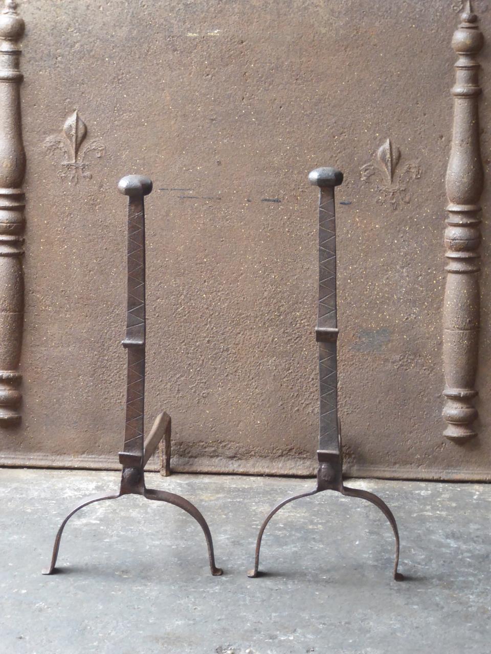 17th century French Gothic andirons. The andirons are made of wrought iron. They have spit hooks to grill food.







 