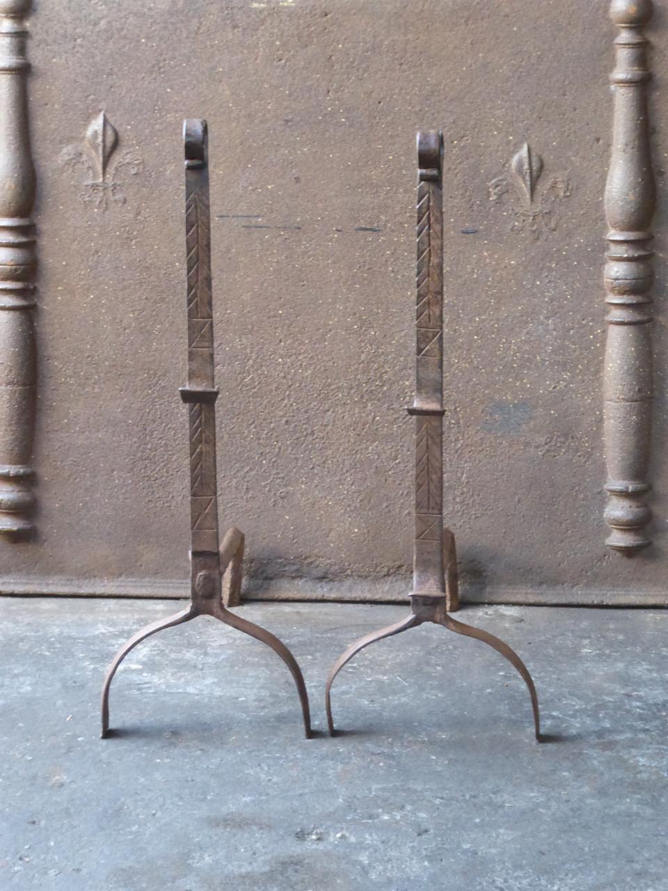 17th century French Gothic andirons. The andirons are beautifully forged and carved. They have spit hooks to grill food.







 