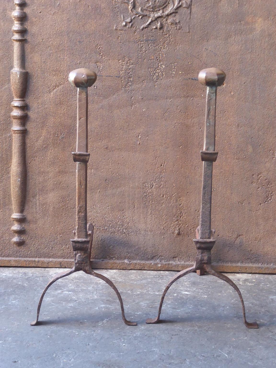 17th century French Gothic andirons. They have spit hooks to grill food. The andirons have a natural brown patina, upon request it can be made black. The condition is good.







   