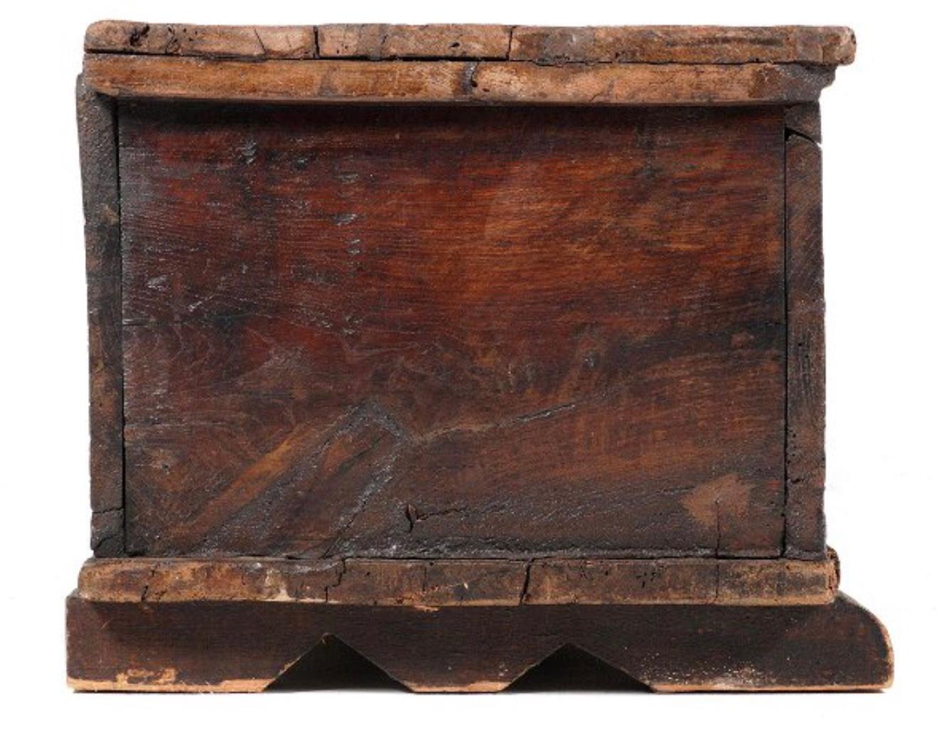 17th Century French Gothic carved trunk. Intricately carved early-17th century Gothic style coffer. This small trunk, having its original hand wrought iron hardware, with a thick and solid carved lift top with beveled edges, and typical relief
