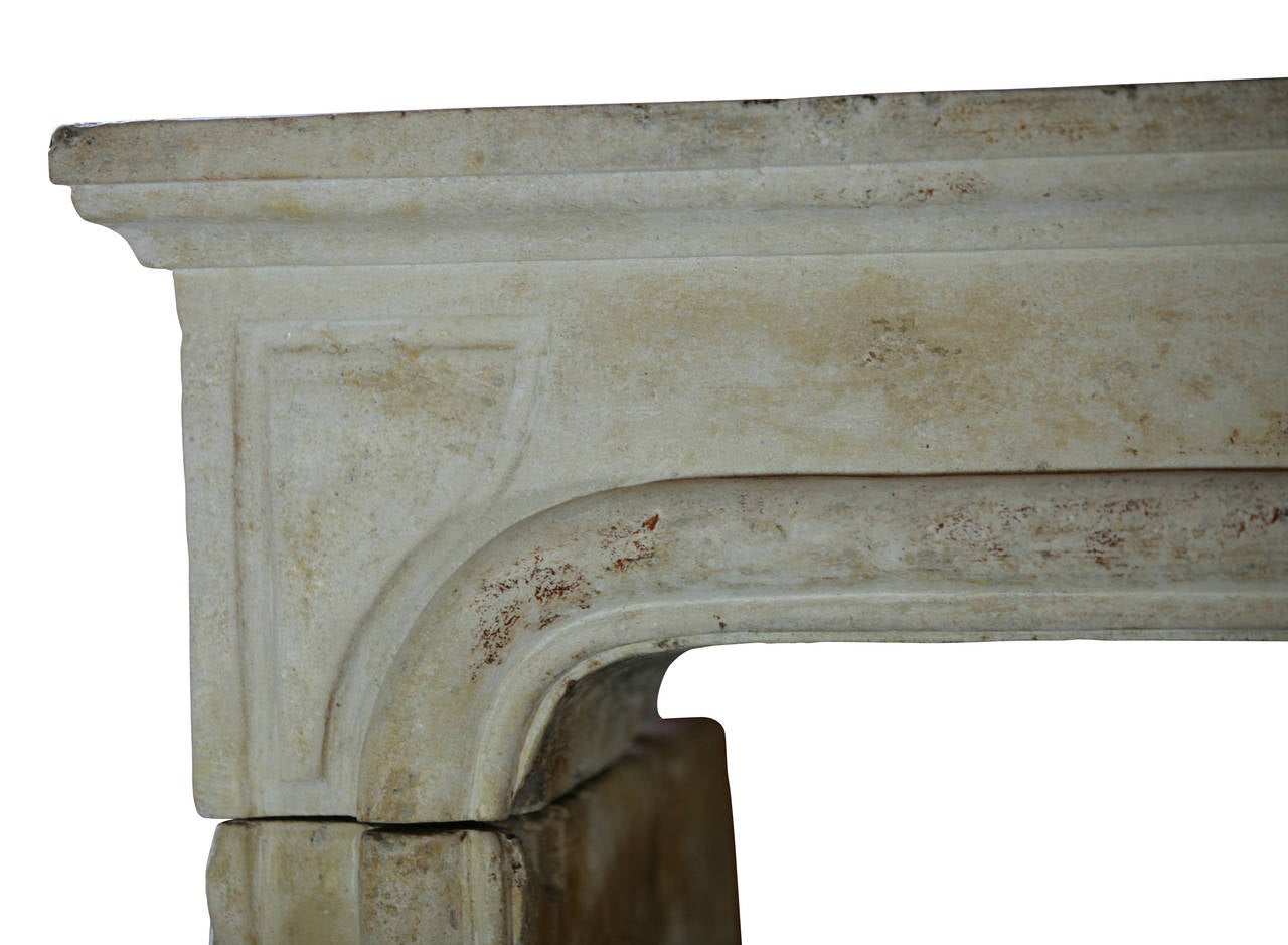 This fireplace surround is from a bourgeois house in the countryside. It has remains of the original patina. A original nice ancient surface. This mantel is in great condition; it is not broken and is totally original with perfect proportions for a