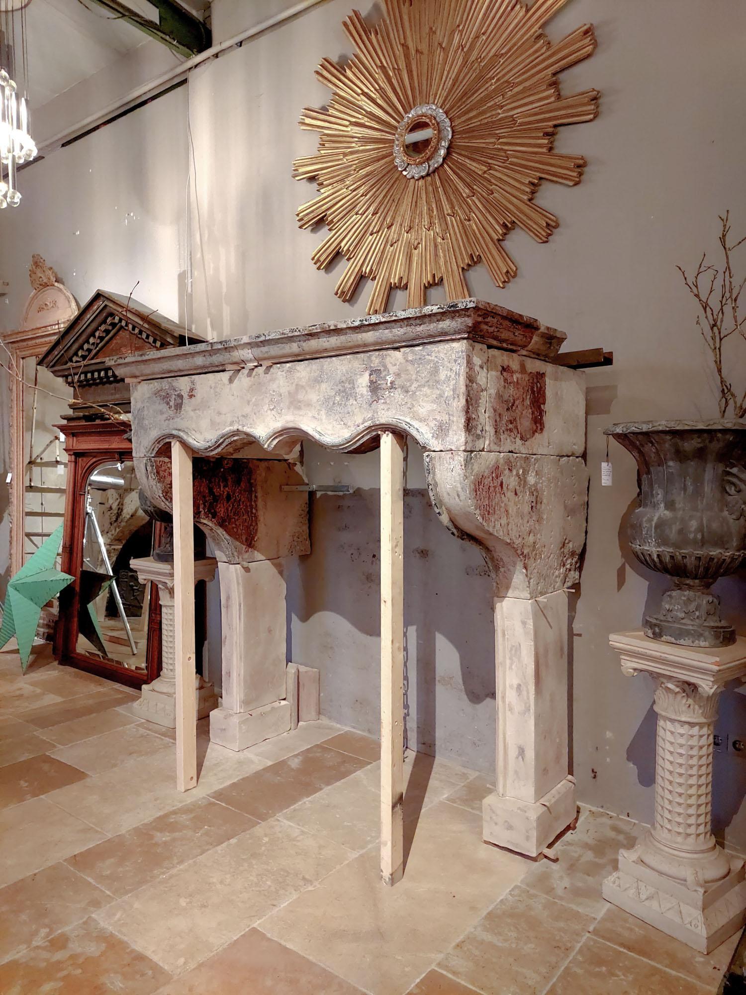 18th Century and Earlier 17th Century French Limestone Mantelpiece with Original Paint Remains