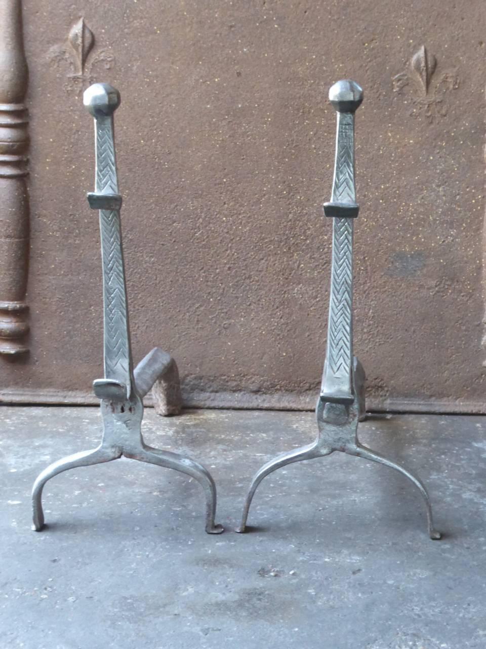 17th century French Louis XIII andirons made of wrought iron.

We have a unique and specialized collection of antique and used fireplace accessories consisting of more than 1000 listings at 1stdibs. Amongst others, we always have 300+ firebacks,