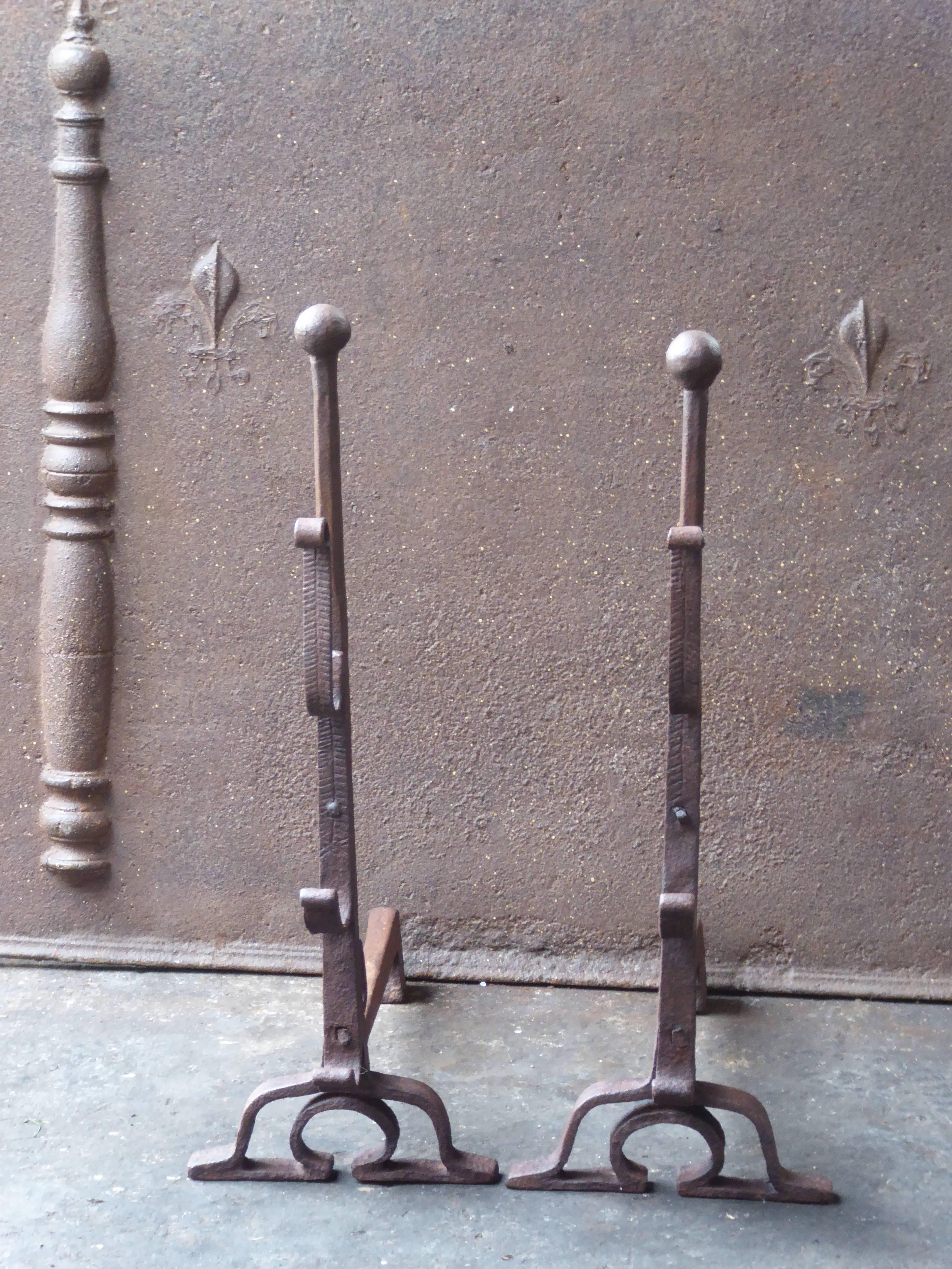 Beautiful 17th century French Louis XIII andirons made of wrought iron.

The condition is good.