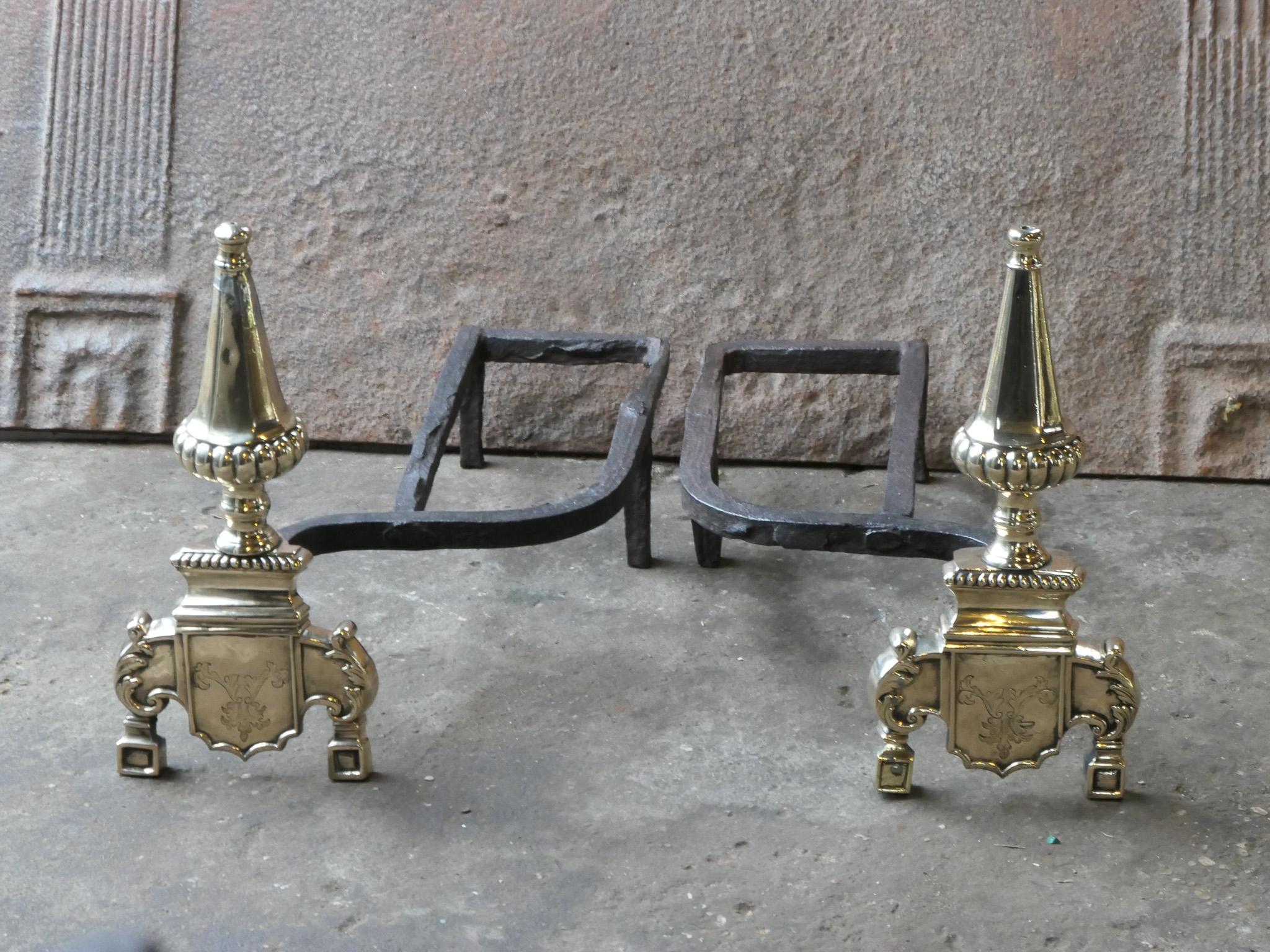 17th century French Louis XIV style andirons made of bronze and wrought iron. The condition is good. The andirons are fit for use in the fireplace.







