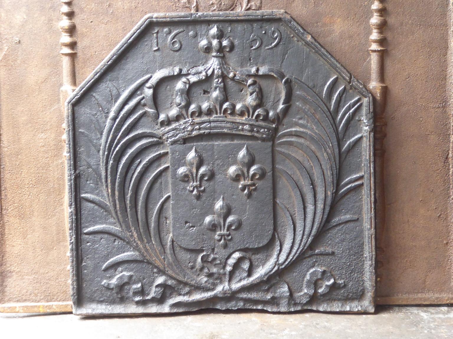 17th century French Louis XIV fireback with the arms of France. This is the coat of arms of the House of Bourbon, an originally French royal house that became a major dynasty in Europe. It delivered kings for Spain (Navarra), France, both Sicilies