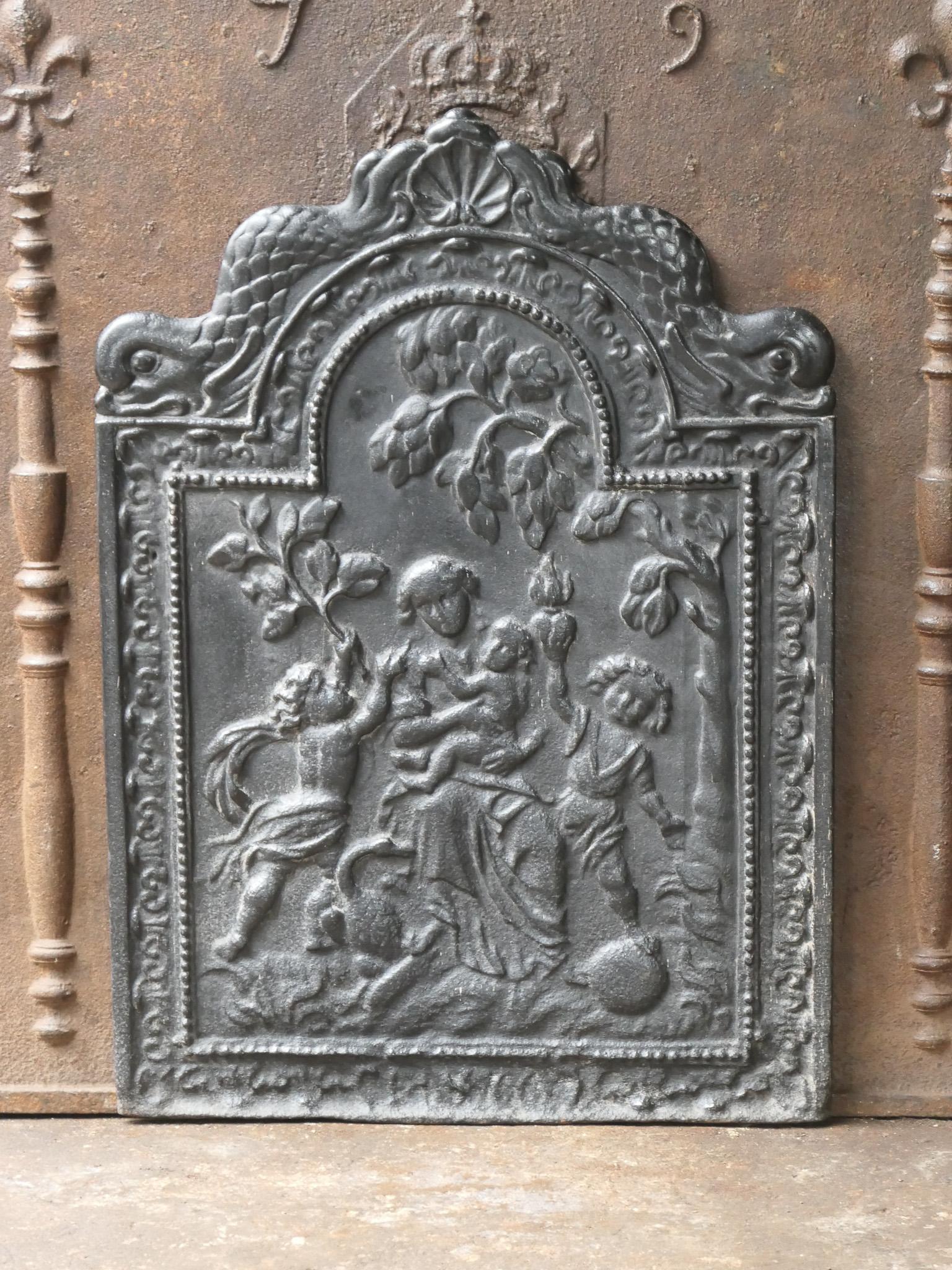 17th century French Louis XIV fireback with the goddess Caritas. Caritas (the care / love). 'Love' from the triptych faith, hope and love, the three theological virtues. The fireback is made of cast iron and has a black / pewter patina.

  