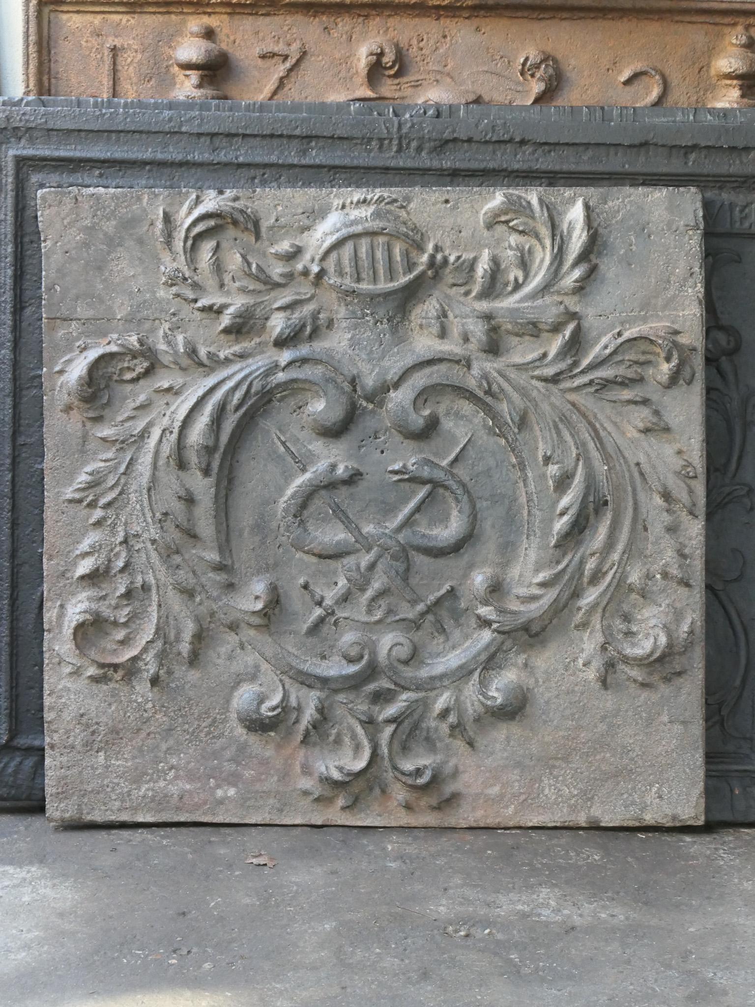 Beautiful 17th century French Louis XIV period fireback with an unknown coat of arms.

The fireback is made of cast iron and has a brown patina. It can be made black / pewter upon request. It is in a good condition, no cracks.

This product weighs