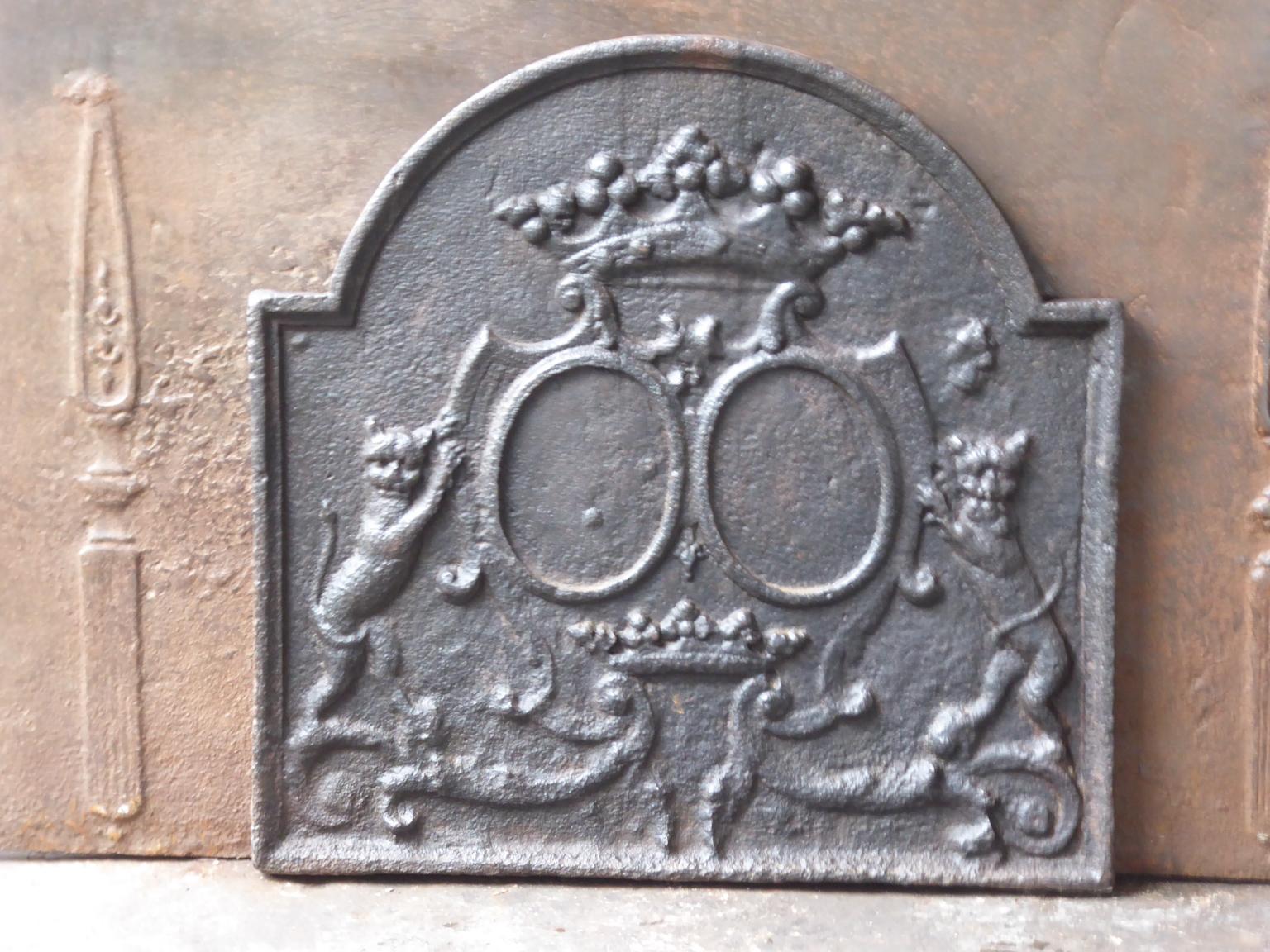 17th century French fireback .The fireback is from the Louis XIV period. It has a natural brown patina. Upon request it can be made black / pewter. The condition is good, no cracks.

 