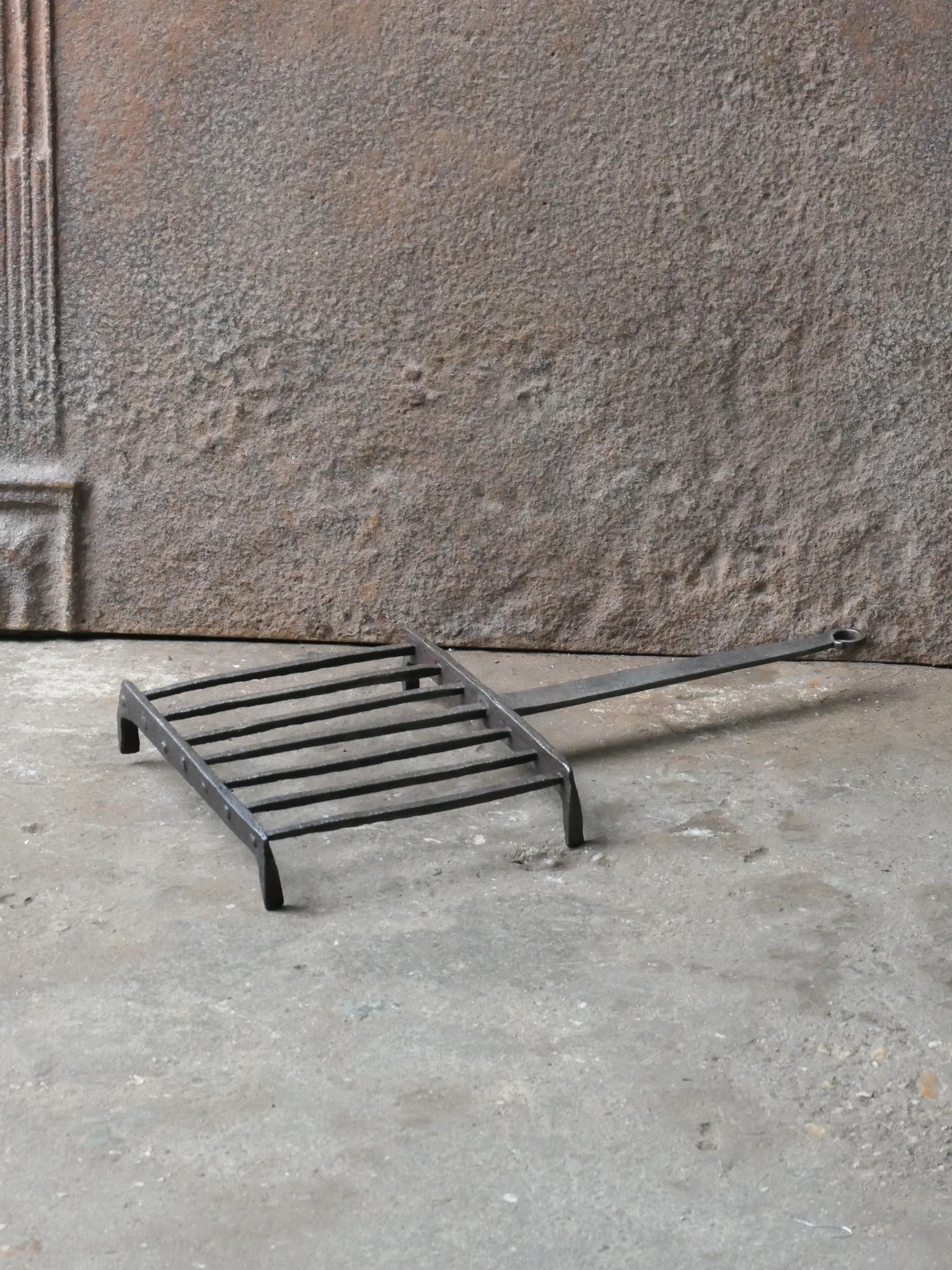 17th century hand forged French gridiron, made of wrought iron. It is used to grill small pieces of meat quickly over the fire. Sometimes they are put in the fire or else on a trivet, depending on the size of the fire. The gridiron is in a good