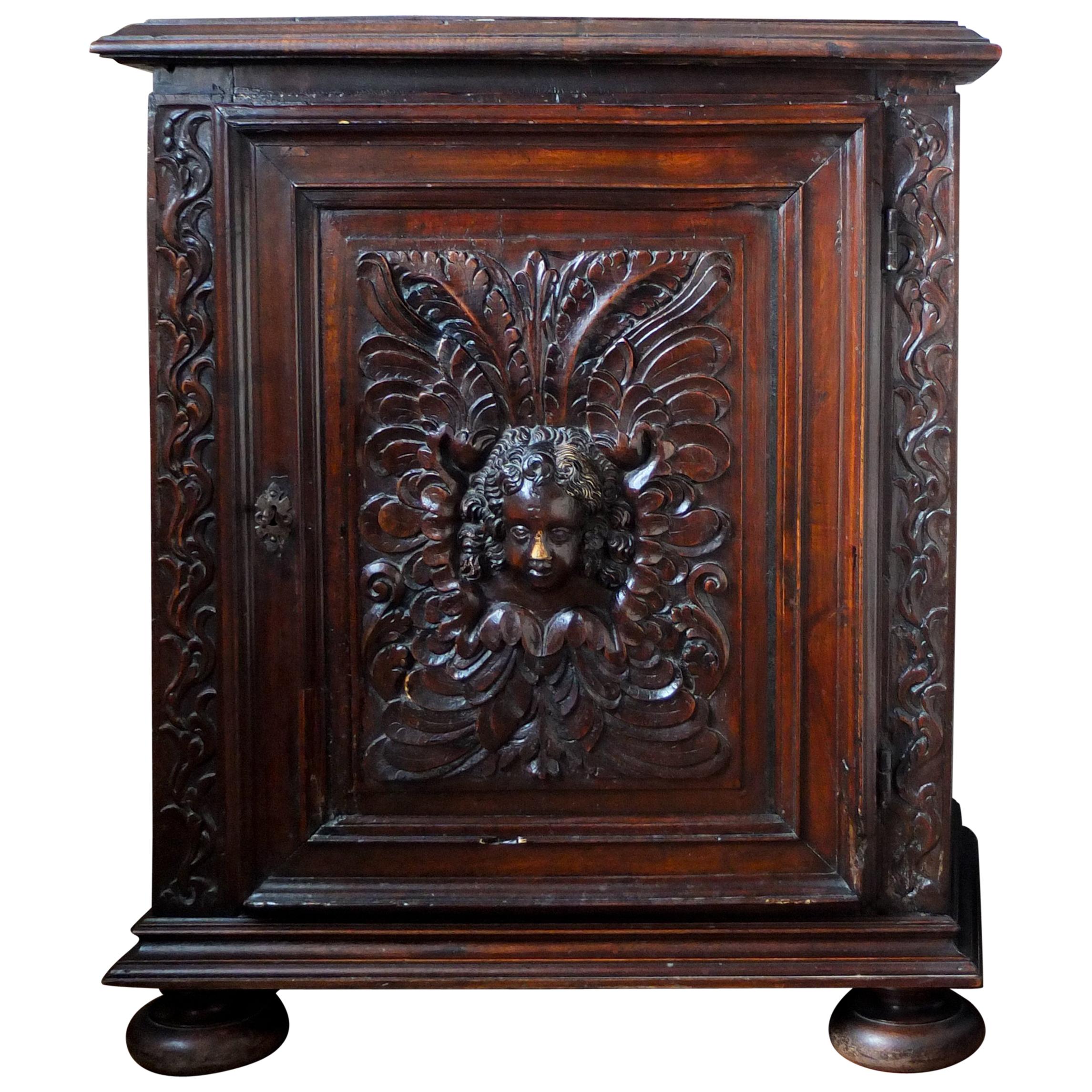 17th Century French Oak Cabinet with an Angel's Head Decoration For Sale