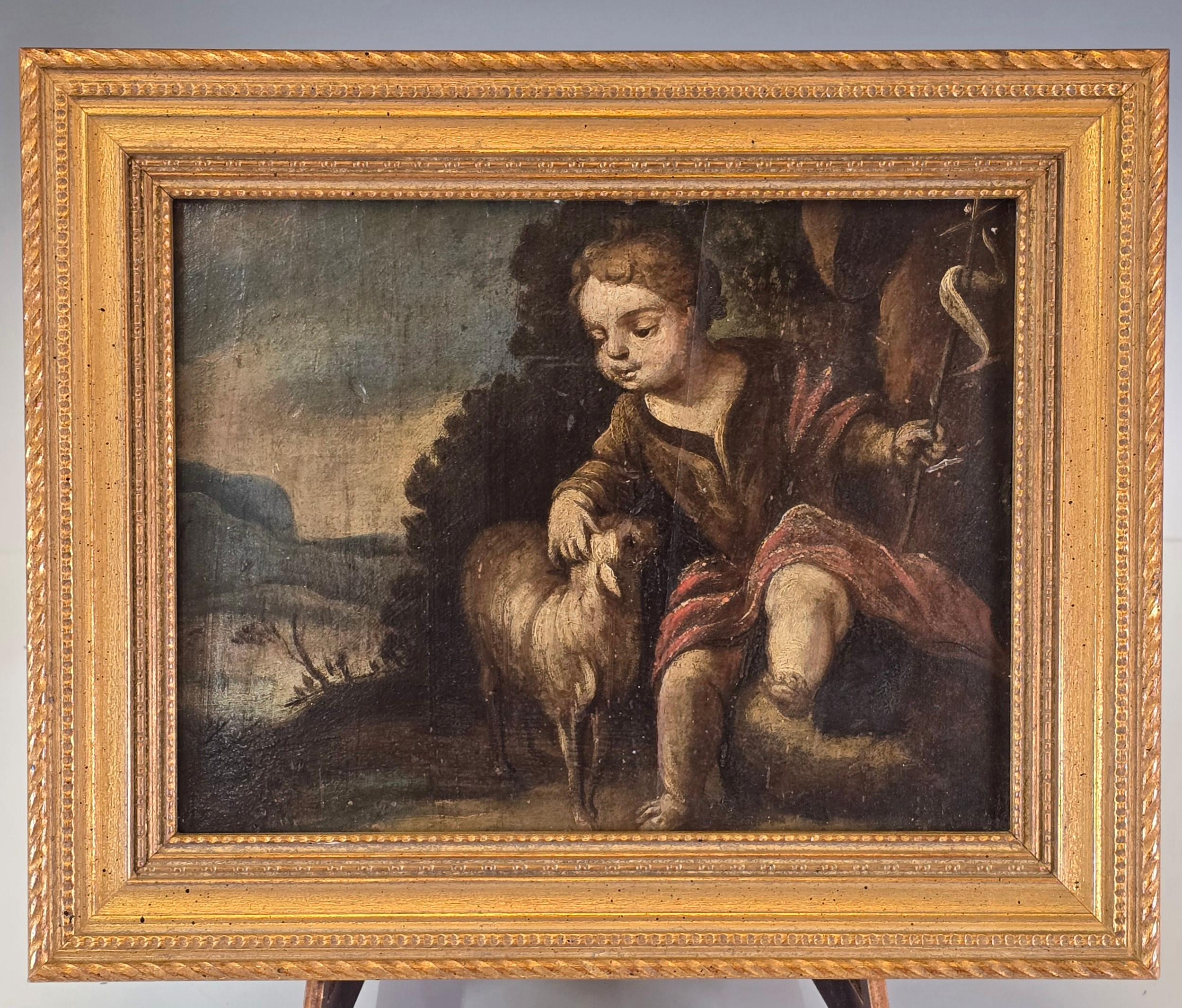 Bellissimo olio su tavola di scuola francese del XVII secolo raffigurante Cristo come pastore bambino, in una cornice dorata più recente.   Bellissimi colori tenui e una raffigurazione molto ben dipinta di Cristo come bambino con le sue pecorelle. 