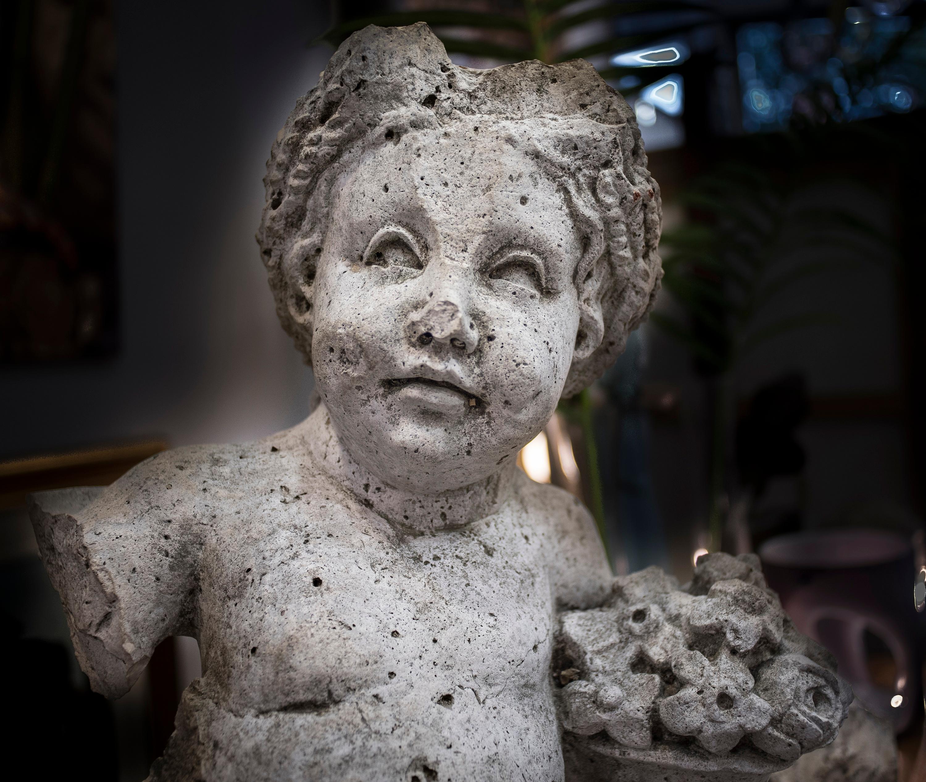 Stunning French stone sculpture representing a child with a basket of flowers. It comes from a very important private French collection, from a Manoir. It could be outside or
inside home. Amazing piece to give a very special and authentic French
