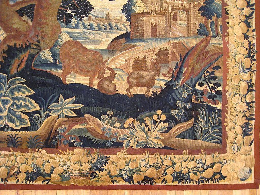 Français Tapisserie de paysage en verdure française du 17e siècle, avec animaux près d'un arbre et d'une chaumière en vente