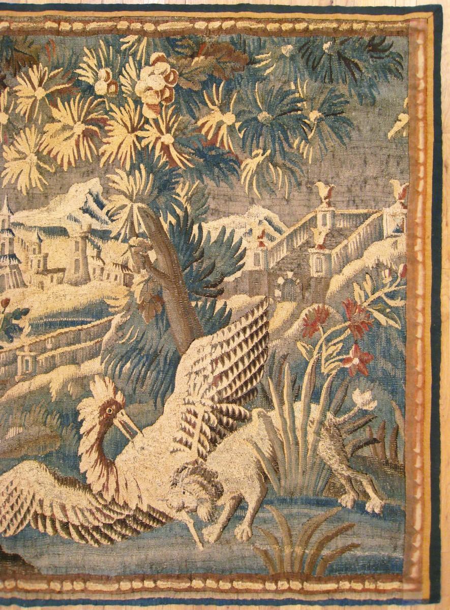 17th Century French Verdure Landscape Tapestry with a Dog Chasing an Exotic Bird In Good Condition For Sale In New York, NY