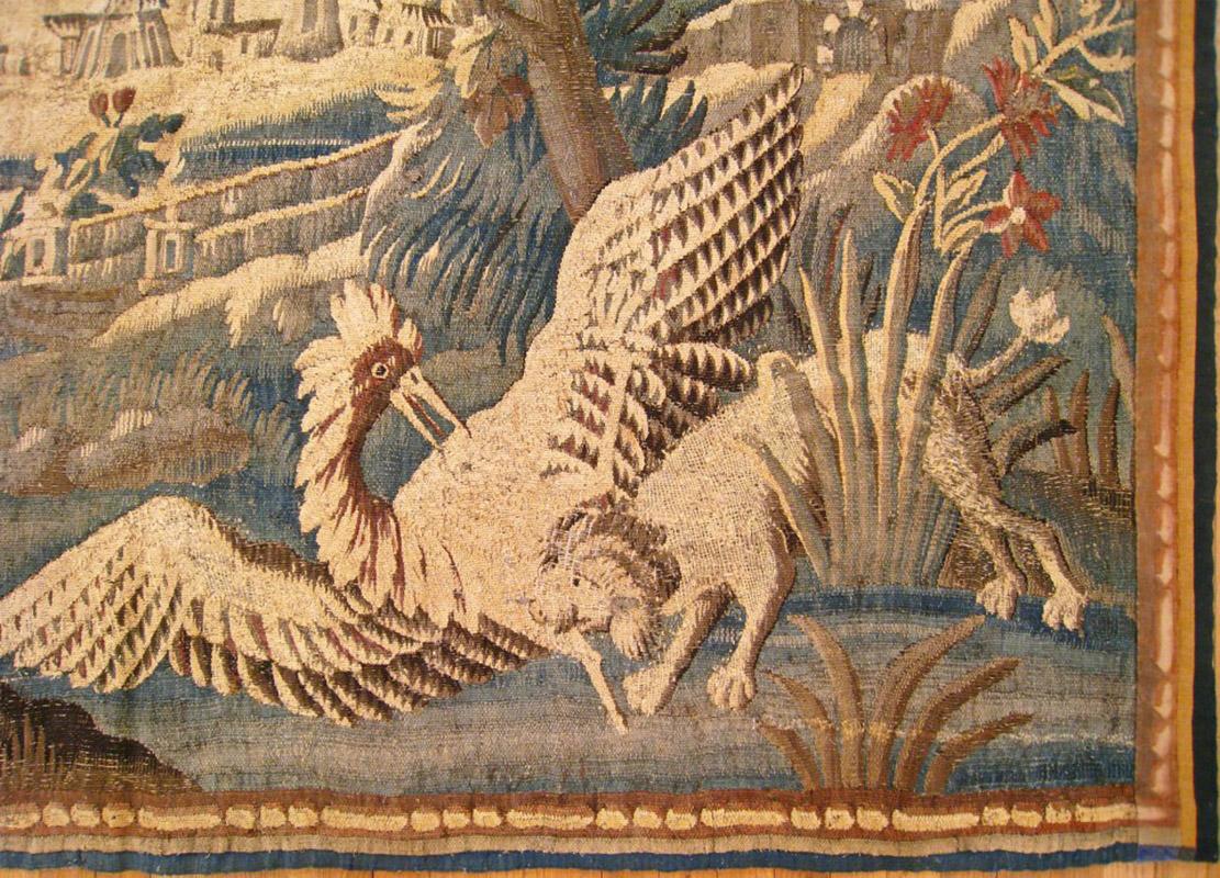 18th Century and Earlier 17th Century French Verdure Landscape Tapestry with a Dog Chasing an Exotic Bird For Sale