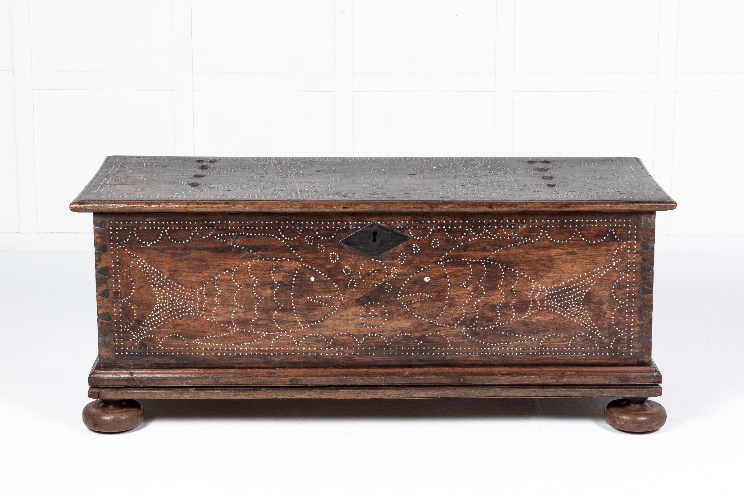 A wonderful, large scale 17th century French walnut coffer with mother of pearl inlay. Having a rectangular hinged top with original ironwork which opens to reveal a candle box to the left and ample storage. This lovely coffer has the unusual