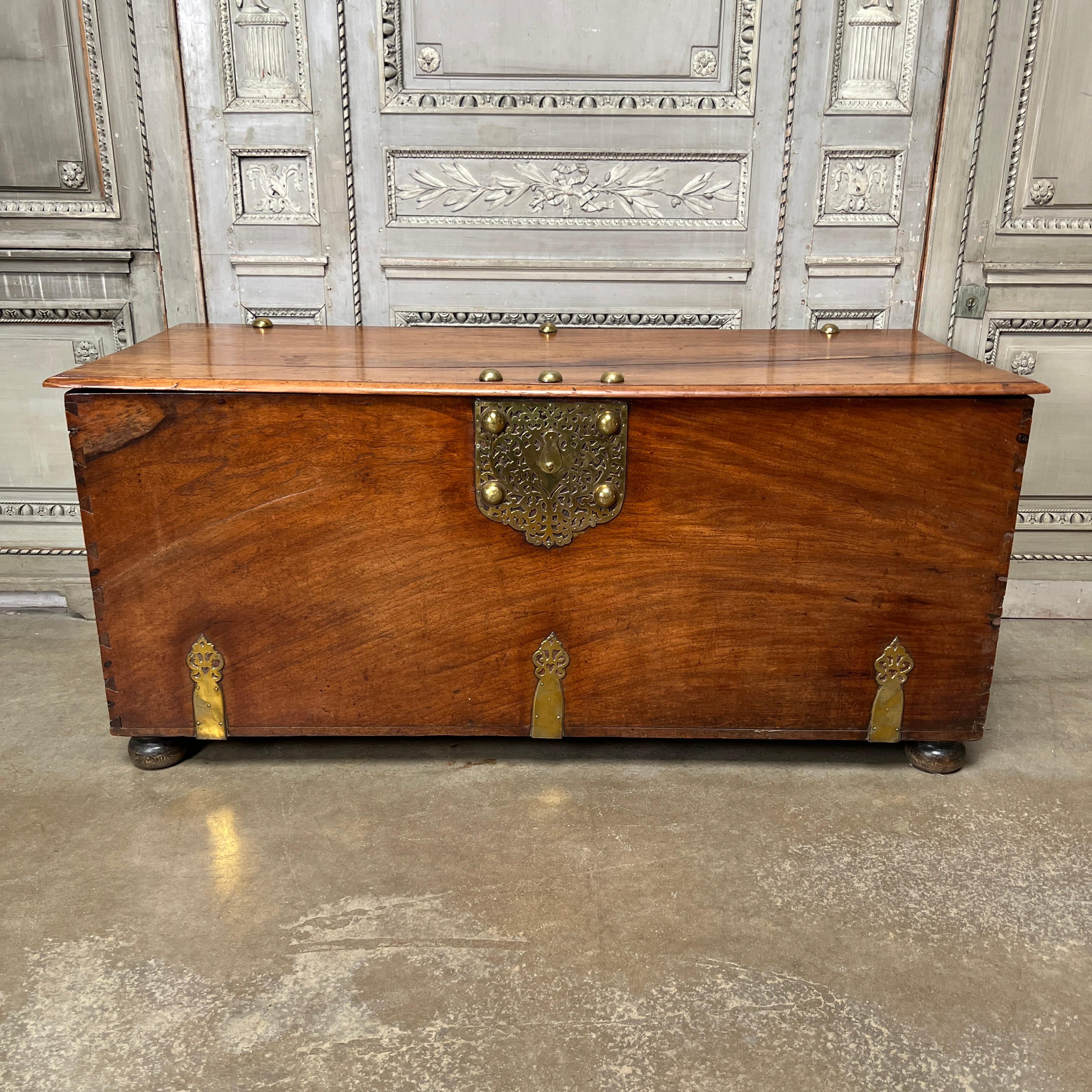 A large French walnut coffer with exceptional hardware. This coffer is made of solid pieces of walnut. This piece would be ideal for a large room, behind a sofa, in a hall or stair landing, It has a large flat surface that you could place lamps on