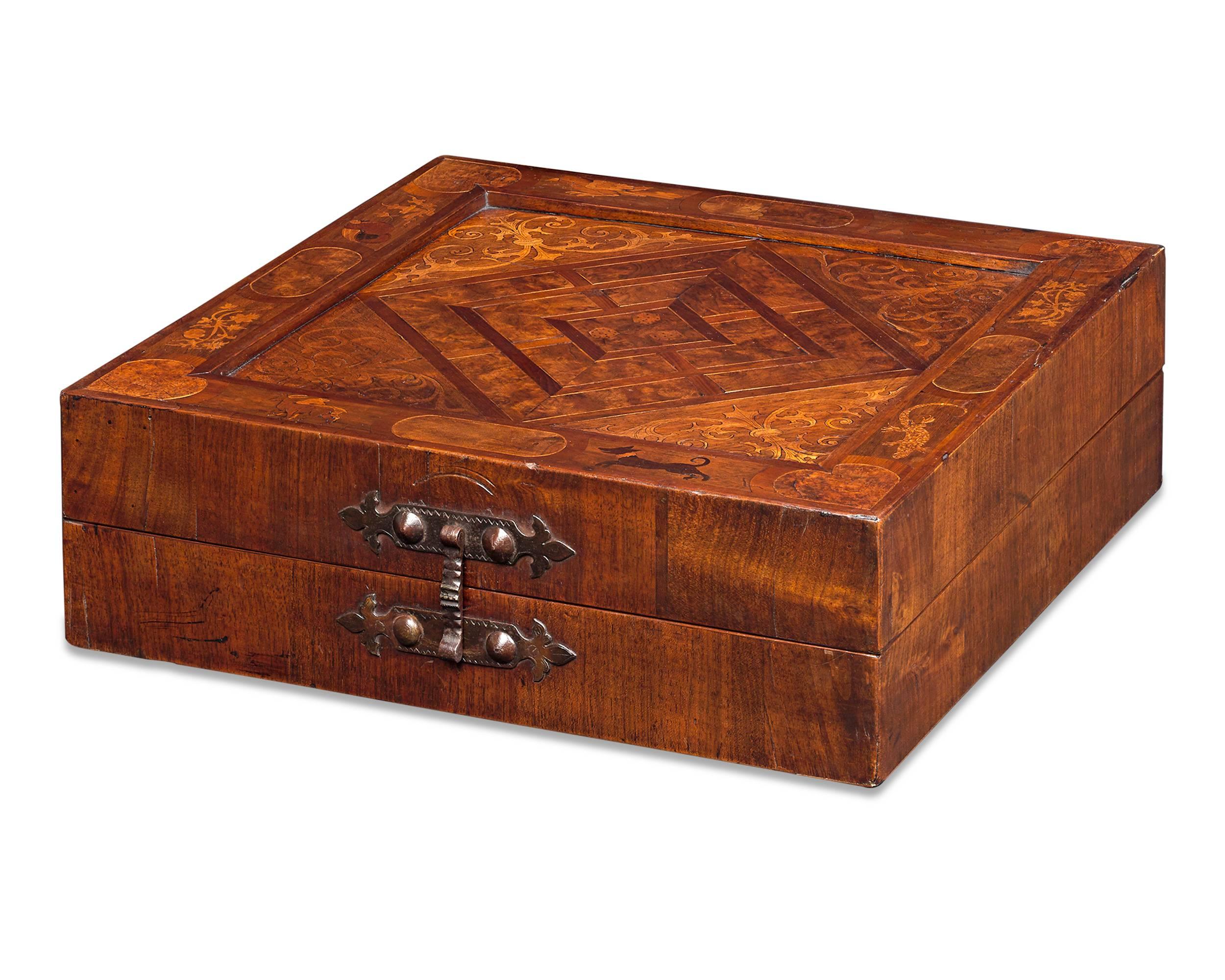 Remarkable condition and craftsmanship distinguish this 17th century German games box. Most likely created in southern Germany, an area well-known for its marquetry craftsmen, such an early and high-quality box would have been a luxury afforded only