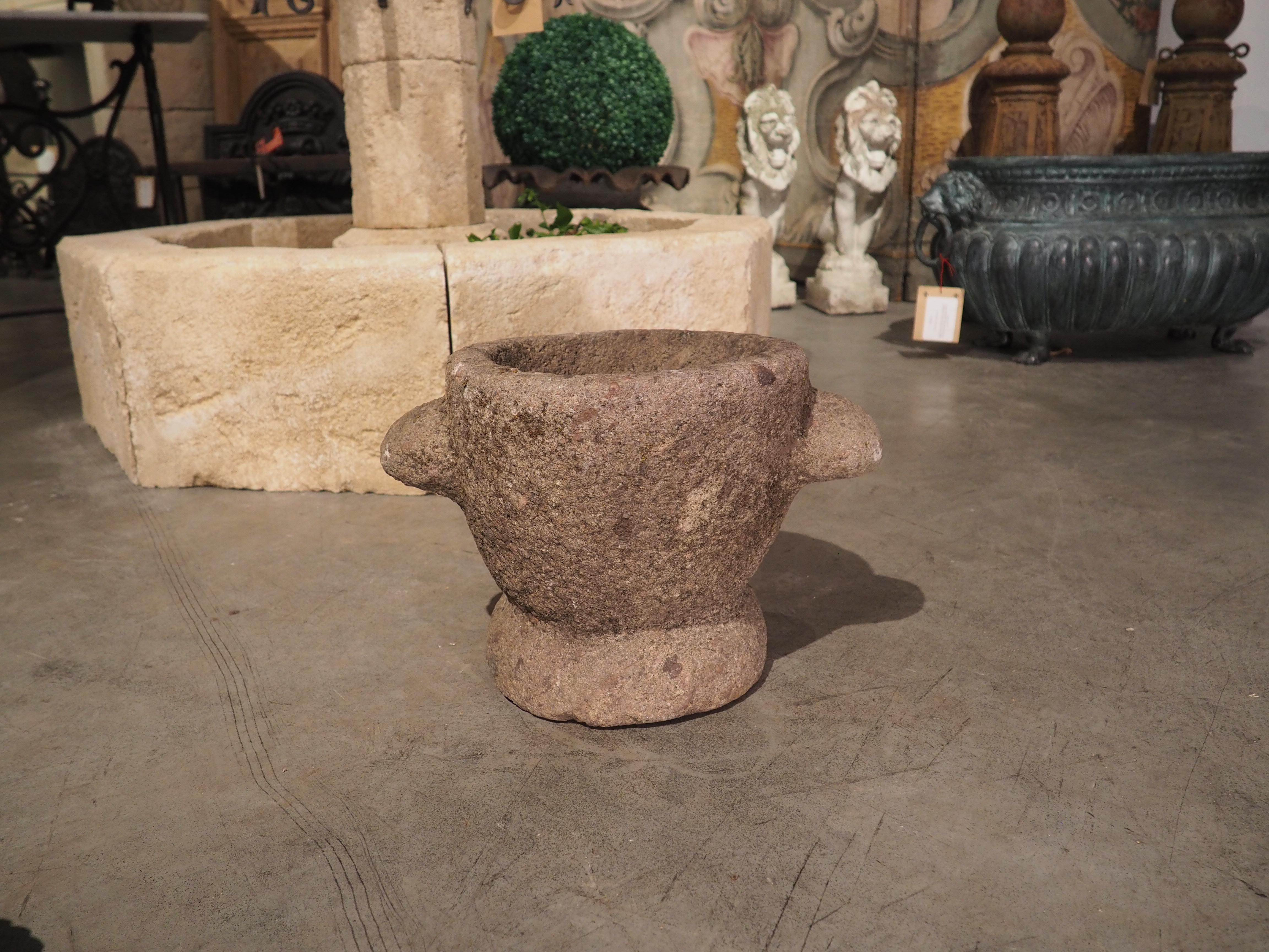 This granite rose mortar was hand-carved in Northern Brittany, France during the 1600’s. Granite is formed when magma is cooled underground, which causes various minerals to become embedded in the stone. Our gray granite has black and gray