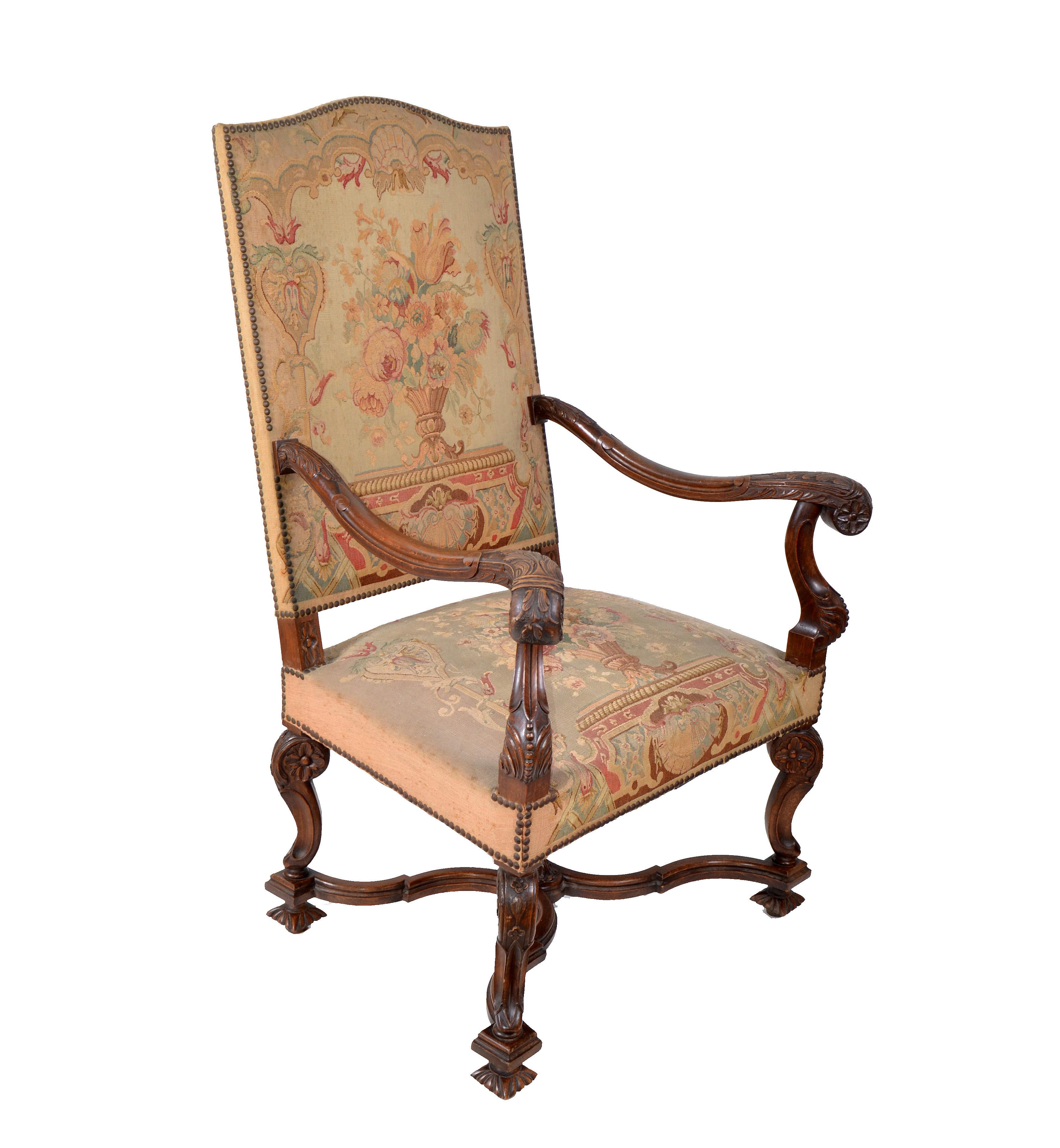 Italian one of a kind hand carved Armchair from the 17th century.
Sturdy and comfortable crafted frame with decorative cross base and beautiful carved wood details.
Nailhead trim adorn the handmade needlepoint upholstered seat and chair