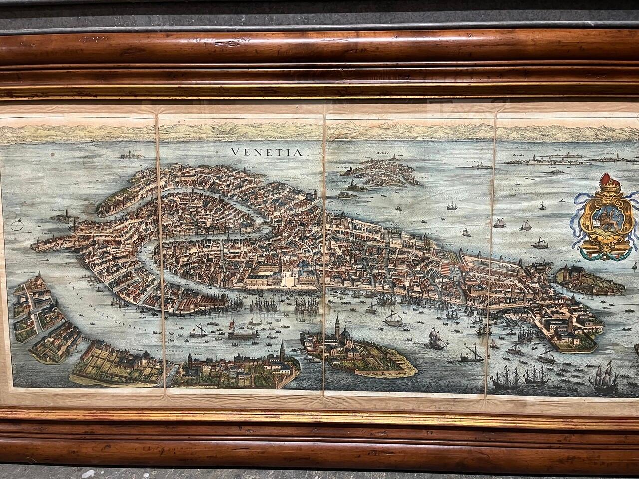 A nice engraved, hand colored view of Venice, originally engraved in 1635. Highly detailed showing the important buildings, the course of the Grand Canal, the Rialto bridge, All in a beautiful antique frame.