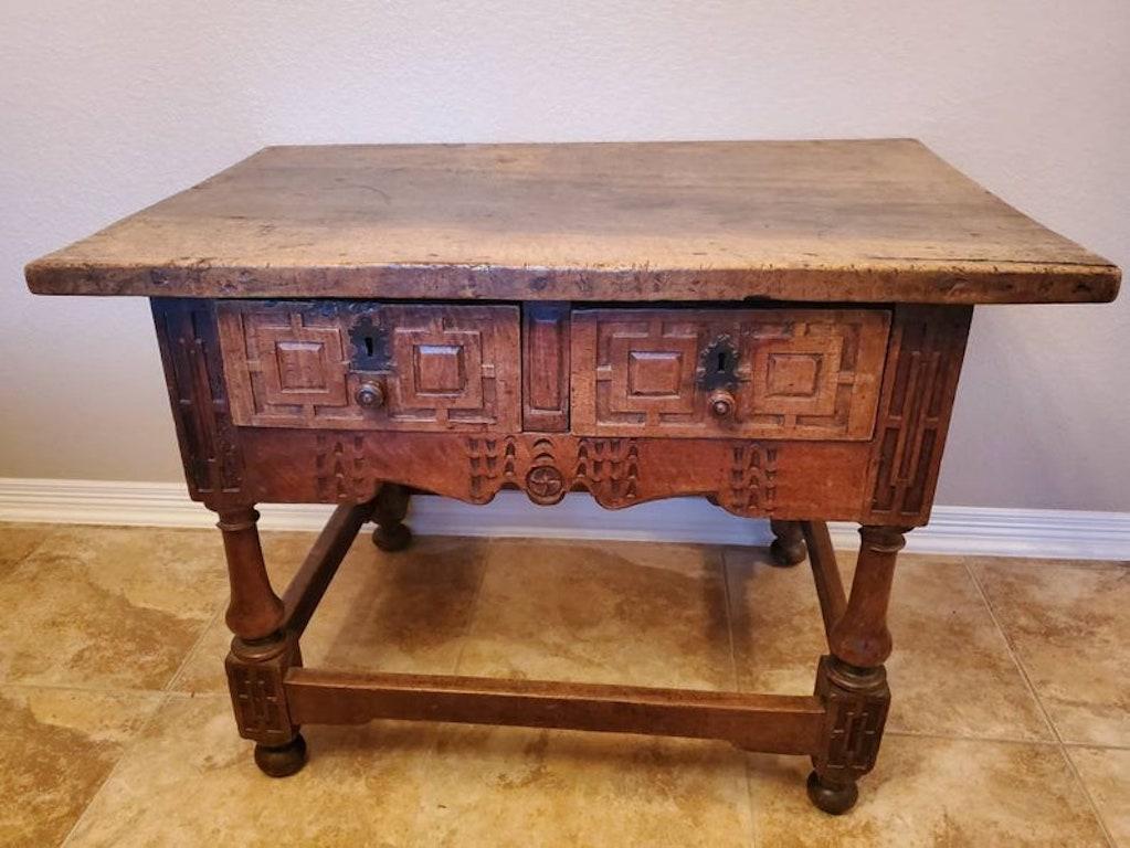 An exceptional rare Iberian (likely Spanish, possibly Portugese) carved walnut table with beautifully aged patina. Circa 1675

Hand-crafted in the second half of the seventeenth century, featuring period construction, having a thick rectangular