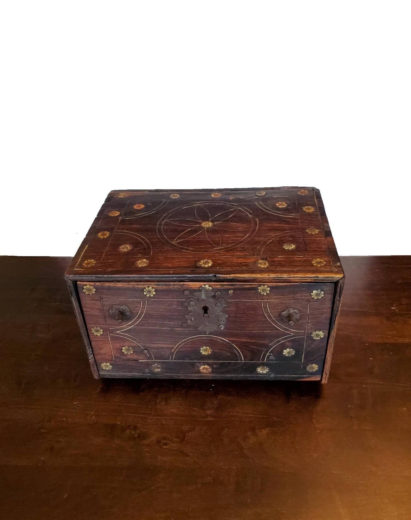 We're proud to present this exceptionally rare and important 400 year old early Baroque Period Indo-Portuguese caixa contador, in Rosewood, Teak, Ebony, Bone, and Ivory marquetry-work, dating to the first half of the 17th century, probably made in