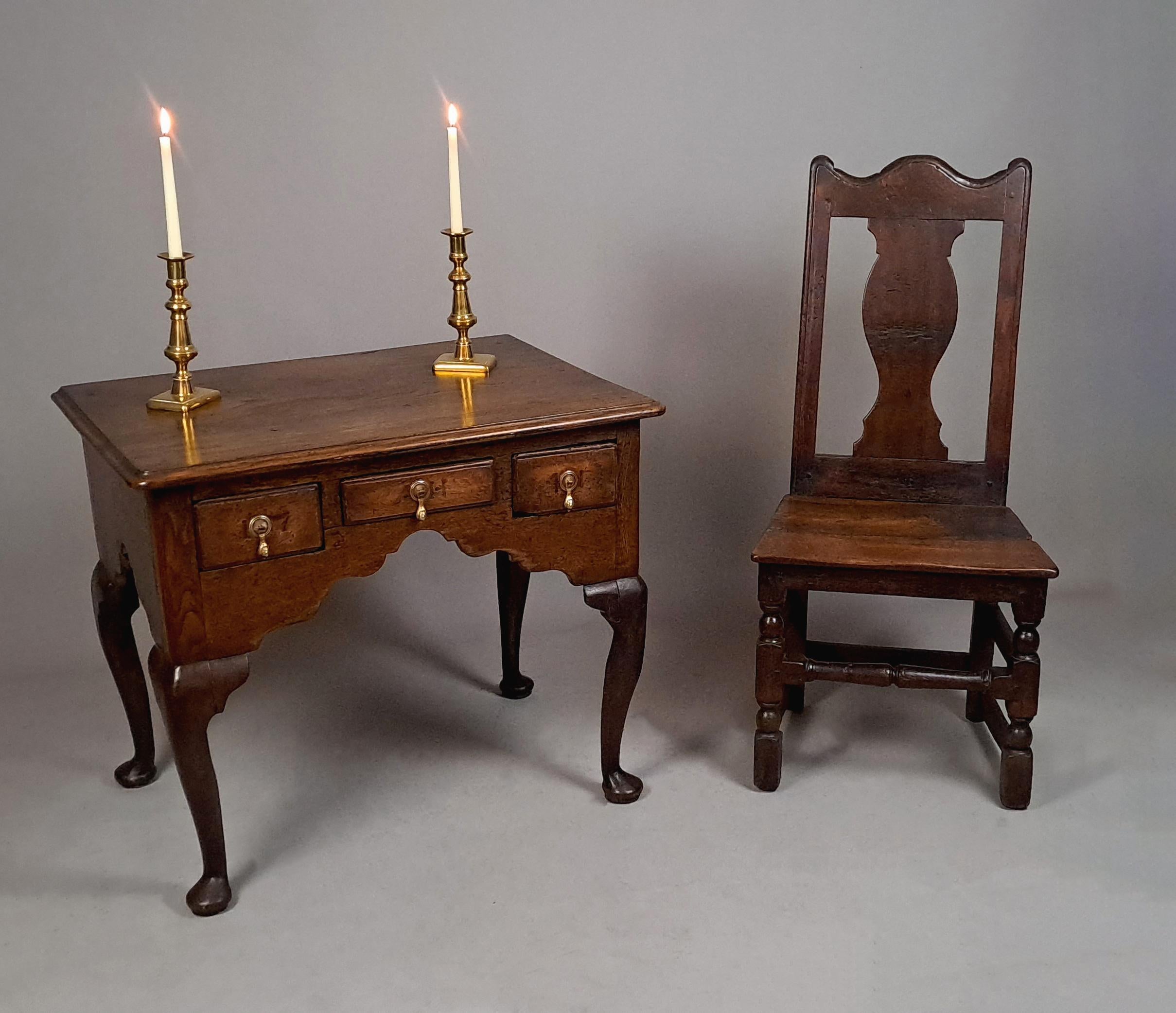 A good late 17th Century solid oak slat back chair with vase shaped splat and solid twin boarded seat, raised on turned and block supports with turned front stretcher and peg joints.

Beautiful colour and rich natural patina.   The original pages