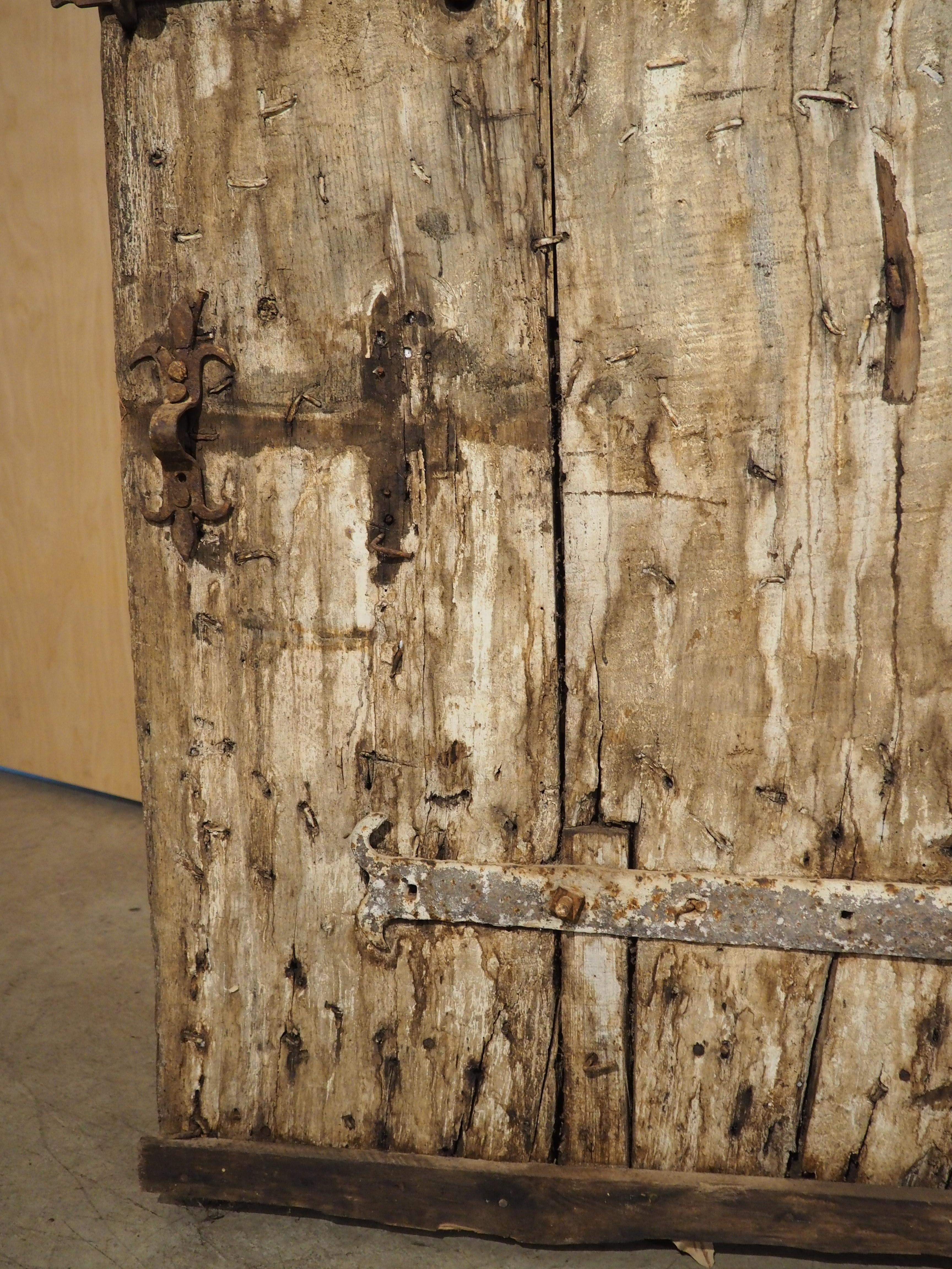 Hand-Carved 17th Century Iron Studded Oak Door from France For Sale