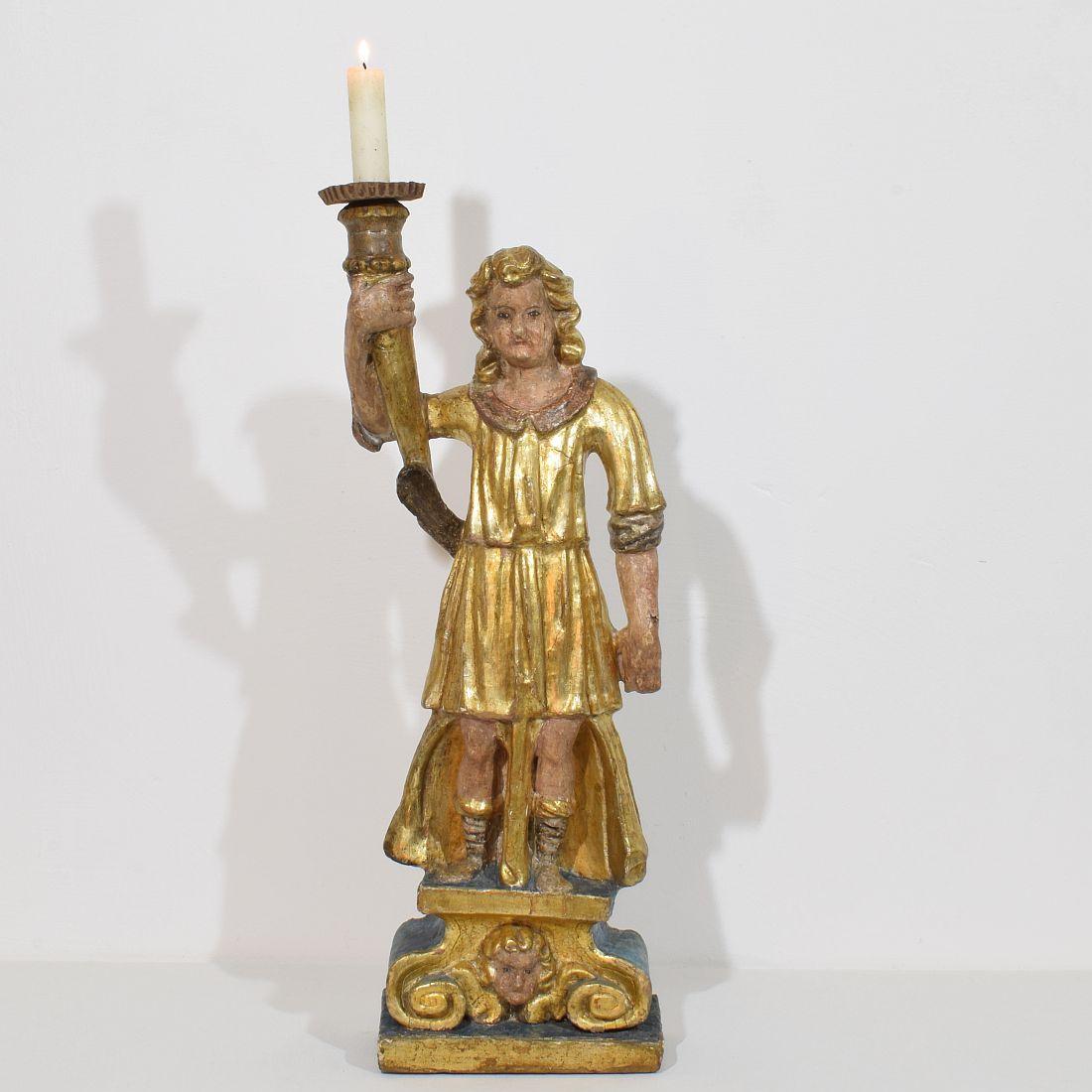 Wonderful angel figure with candle holder. Beautiful traces of the original paint and gilding visible, 
Italy, circa 1650-1700. Weathered and old repair
More pictures available on request.