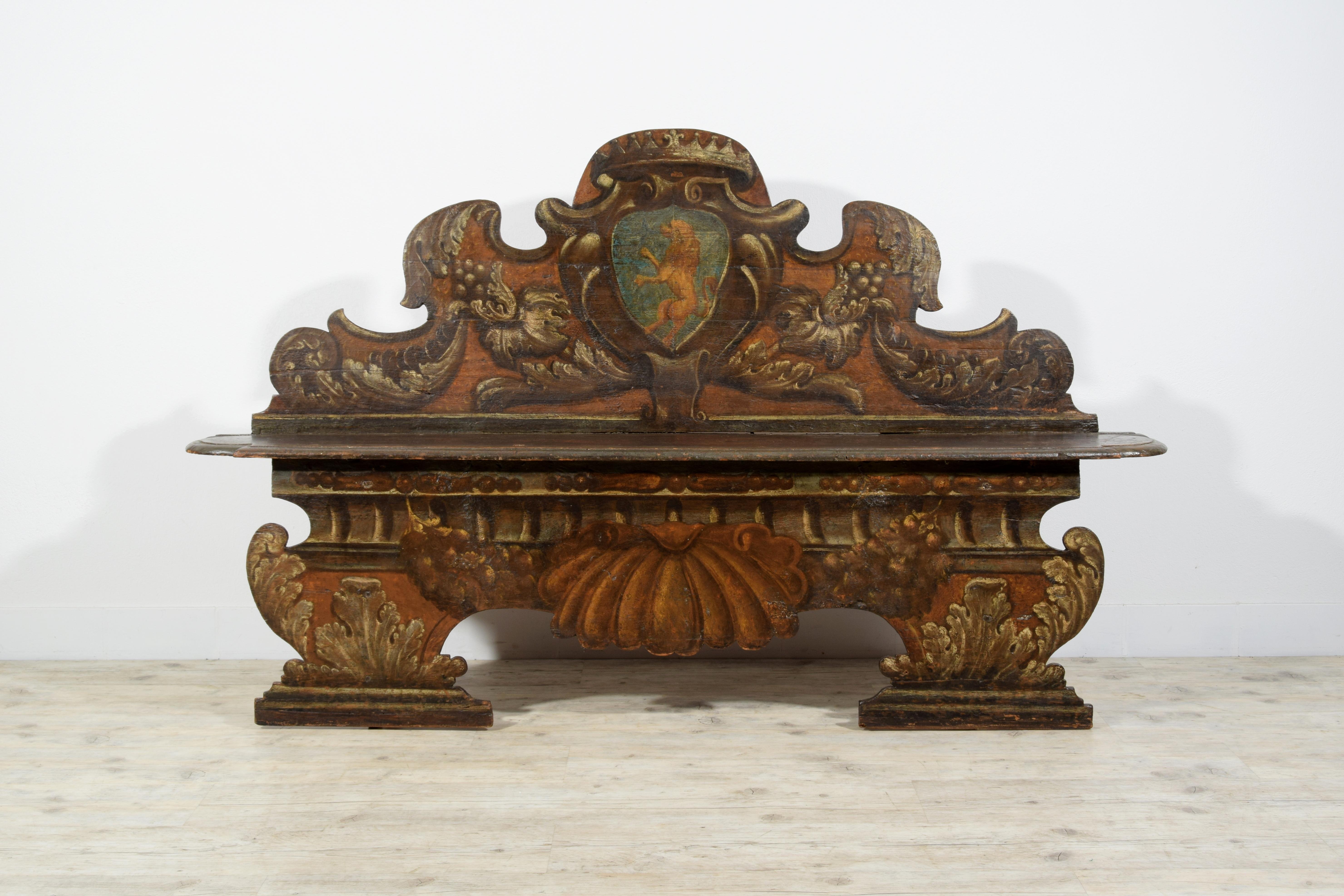 17th century, Italian Baroque Lacquered Wood Bench 

Measurements: W maximum 190 x H 114 x D maximum 31. Seat D 25 x H 54 
This ancient baroque bench was made in Tuscany, Italy, in the seventeenth century. The lacquered wooden structure has trompe