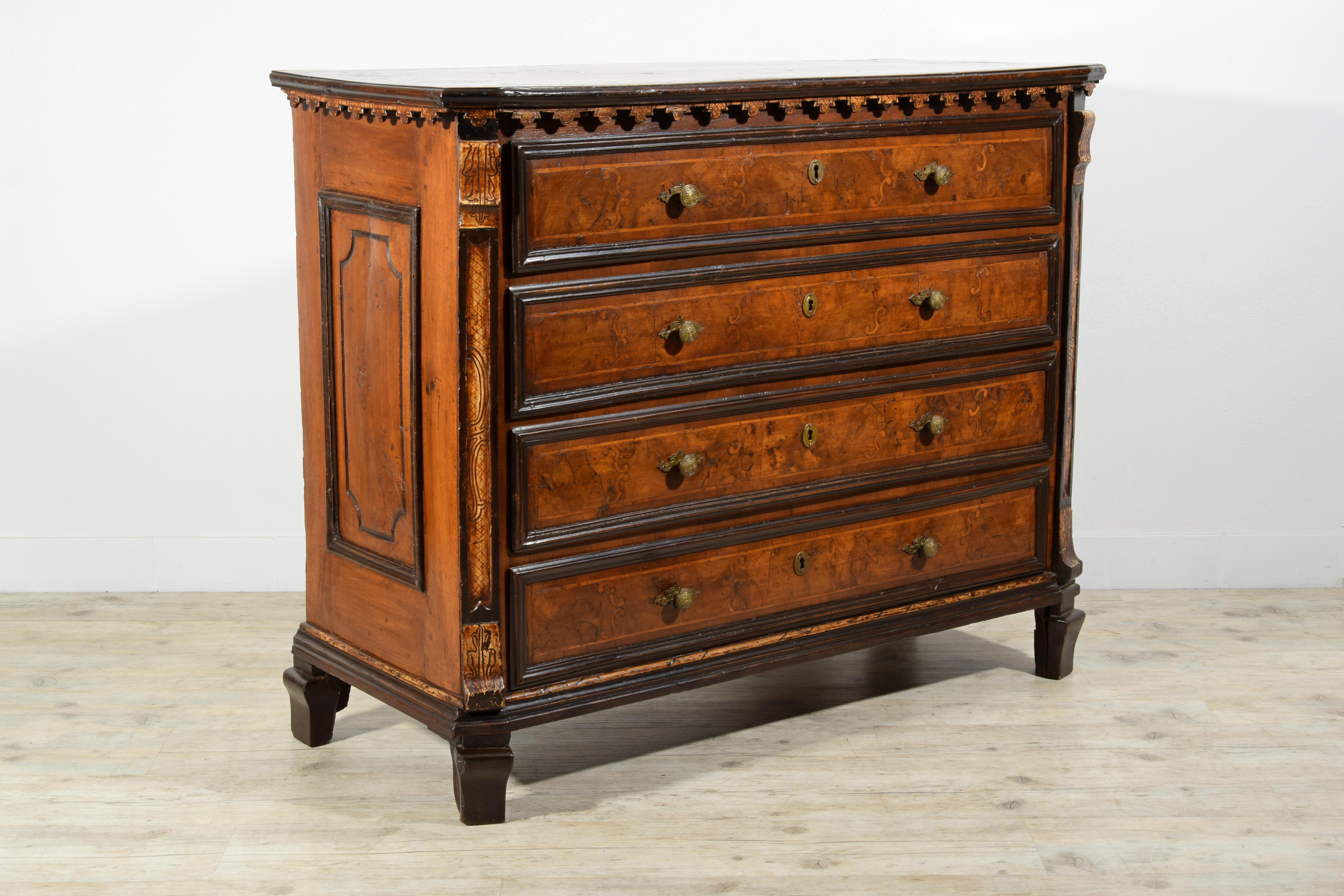 17th Century, Italian Baroque Walnut Chest of Drawers

This chest of drawers was made in Lombardy in the Baroque period at the end of the seventeenth century. The wooden structure is in solid walnut, veneered and inlaid with walnut briar and soft