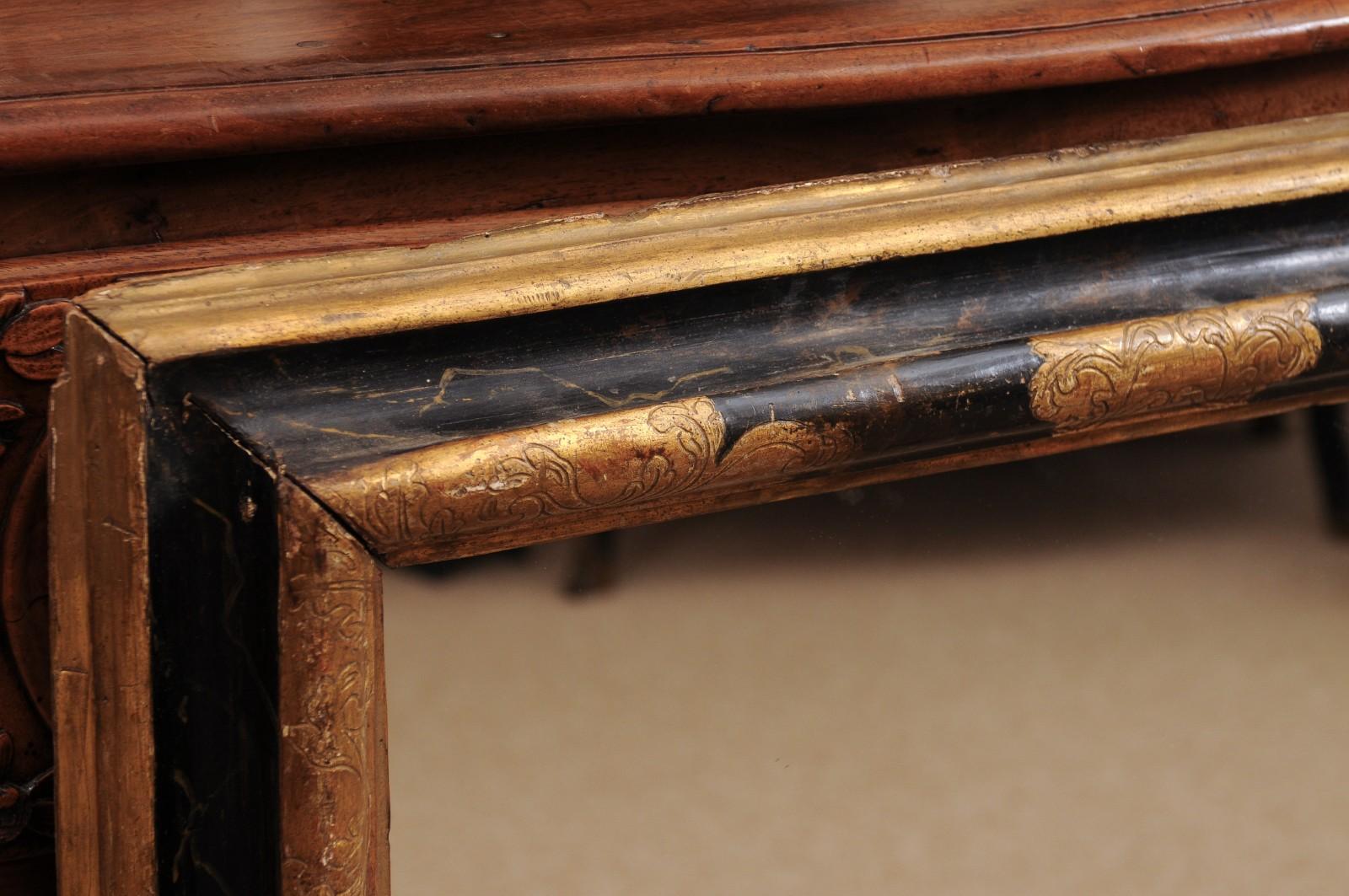Miroir italien du 17e siècle en bois doré ébonisé et parcellaire en vente 6