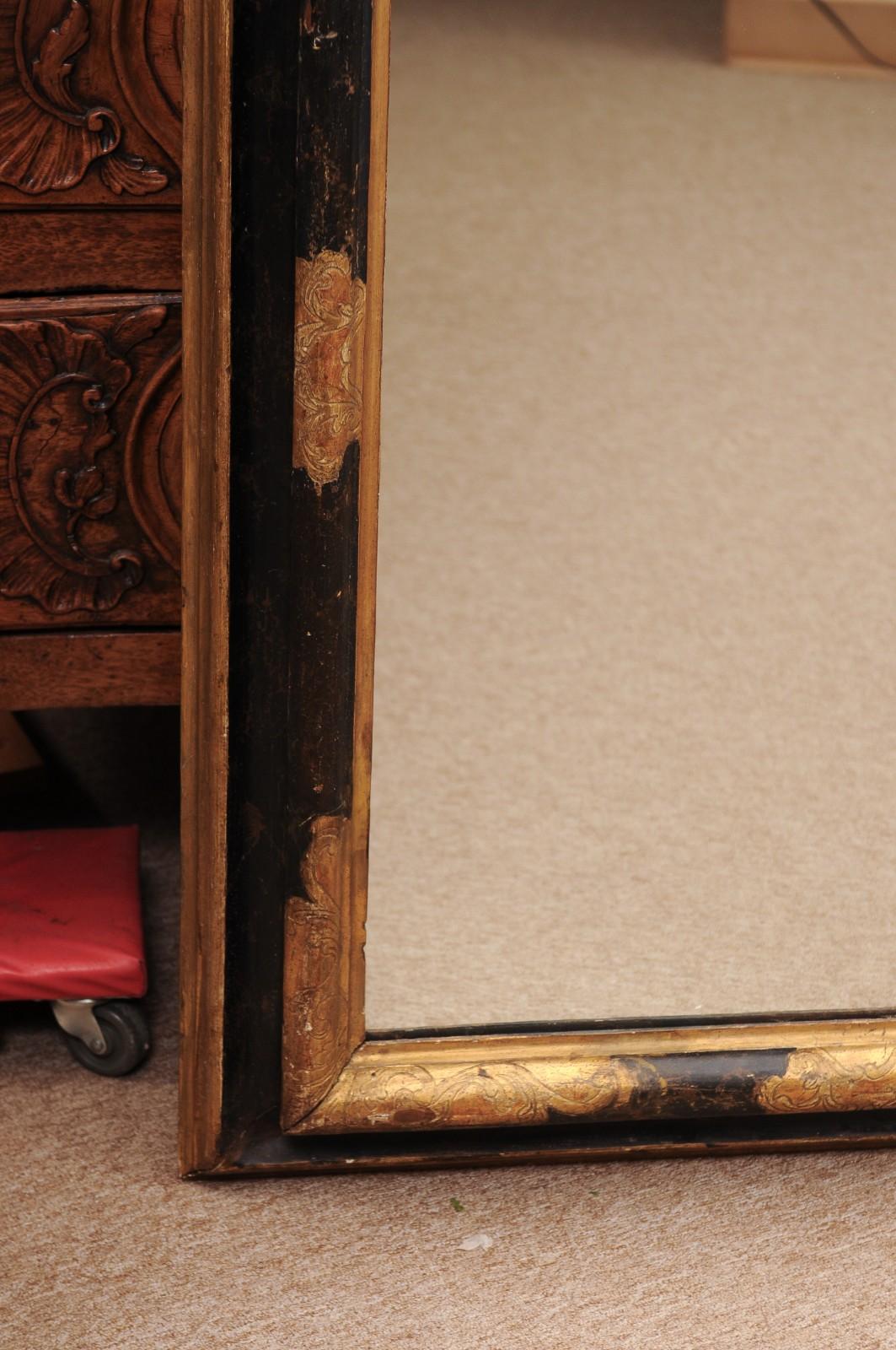Miroir italien du 17e siècle en bois doré ébonisé et parcellaire en vente 1