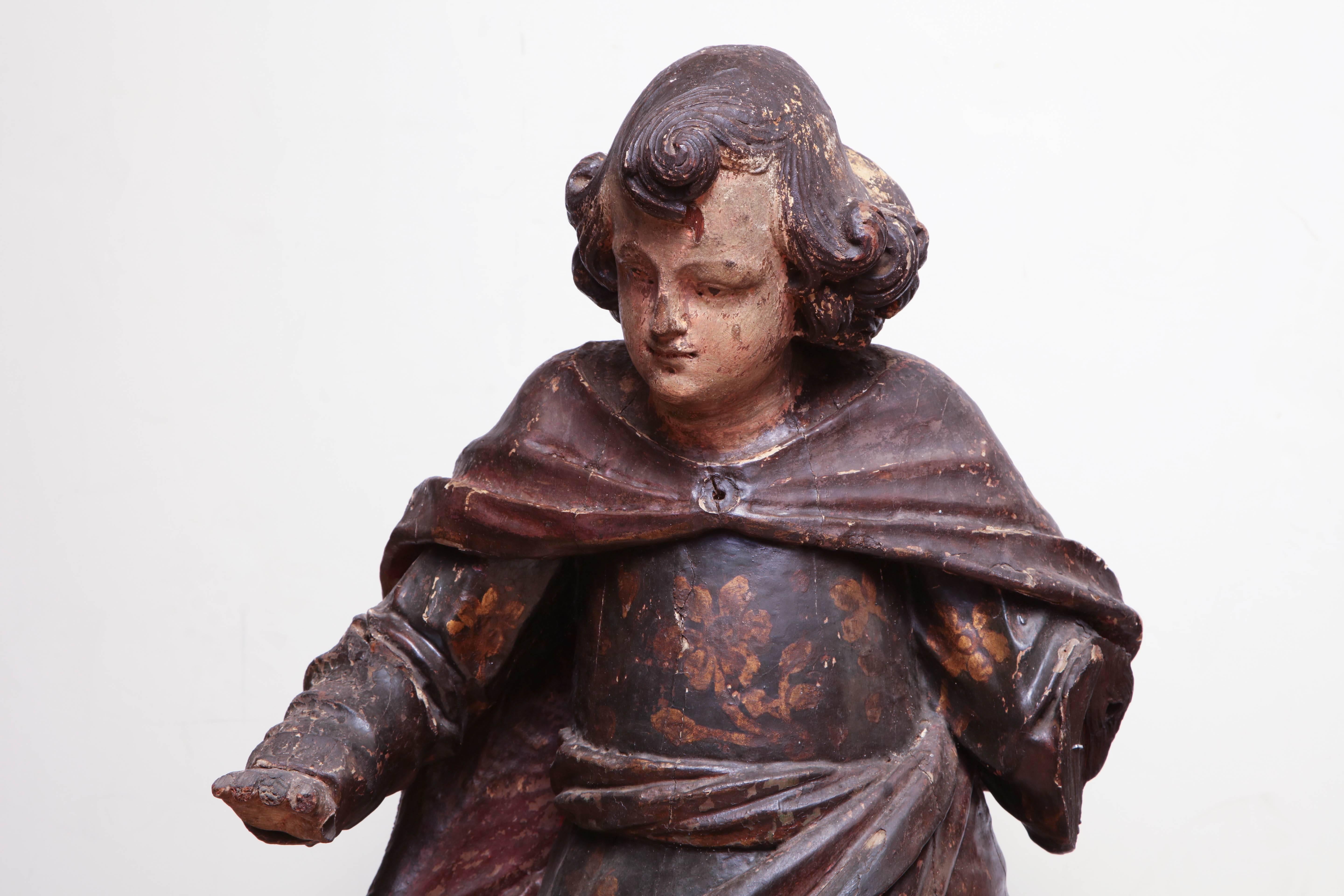 Italian 17th century painted and carved figure of a boy.