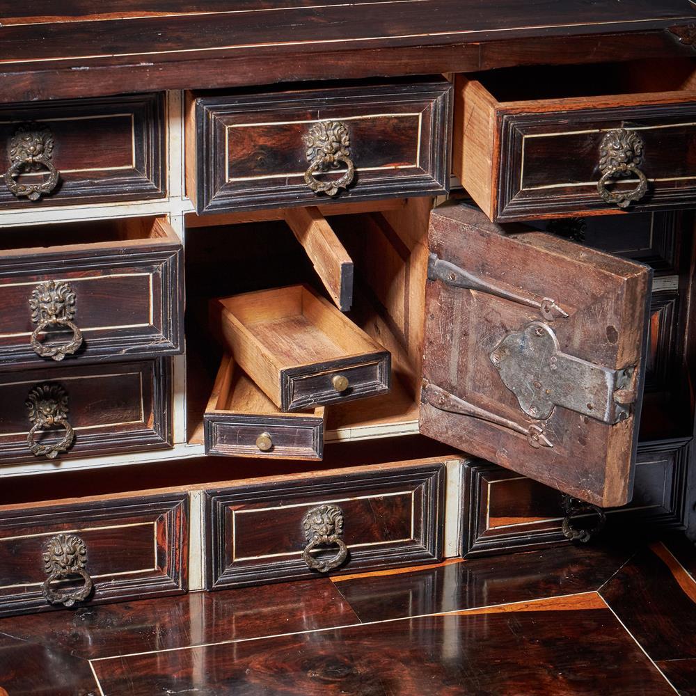 A rare 17th Century Milanese cocus wood table cabinet, circa 1660.  

This extraordinary piece offers a glimpse into the opulence and artistry of the Italian Baroque period. Meticulously fashioned from cocus wood - a material prized for its