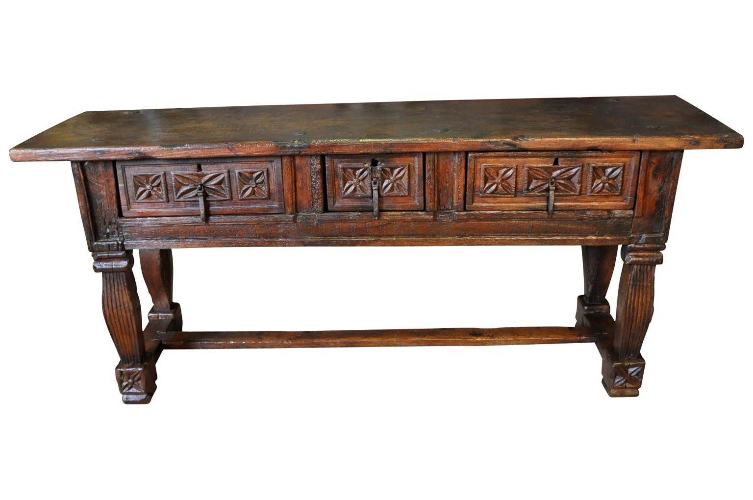 A very handsome 17th century console table from Tuscany. Wonderfully constructed from beautiful chestnut with three drawers and a solid board top. Gorgeous patina rich and luminous. Its narrow depth makes this piece ideal as a sofa table as well.
