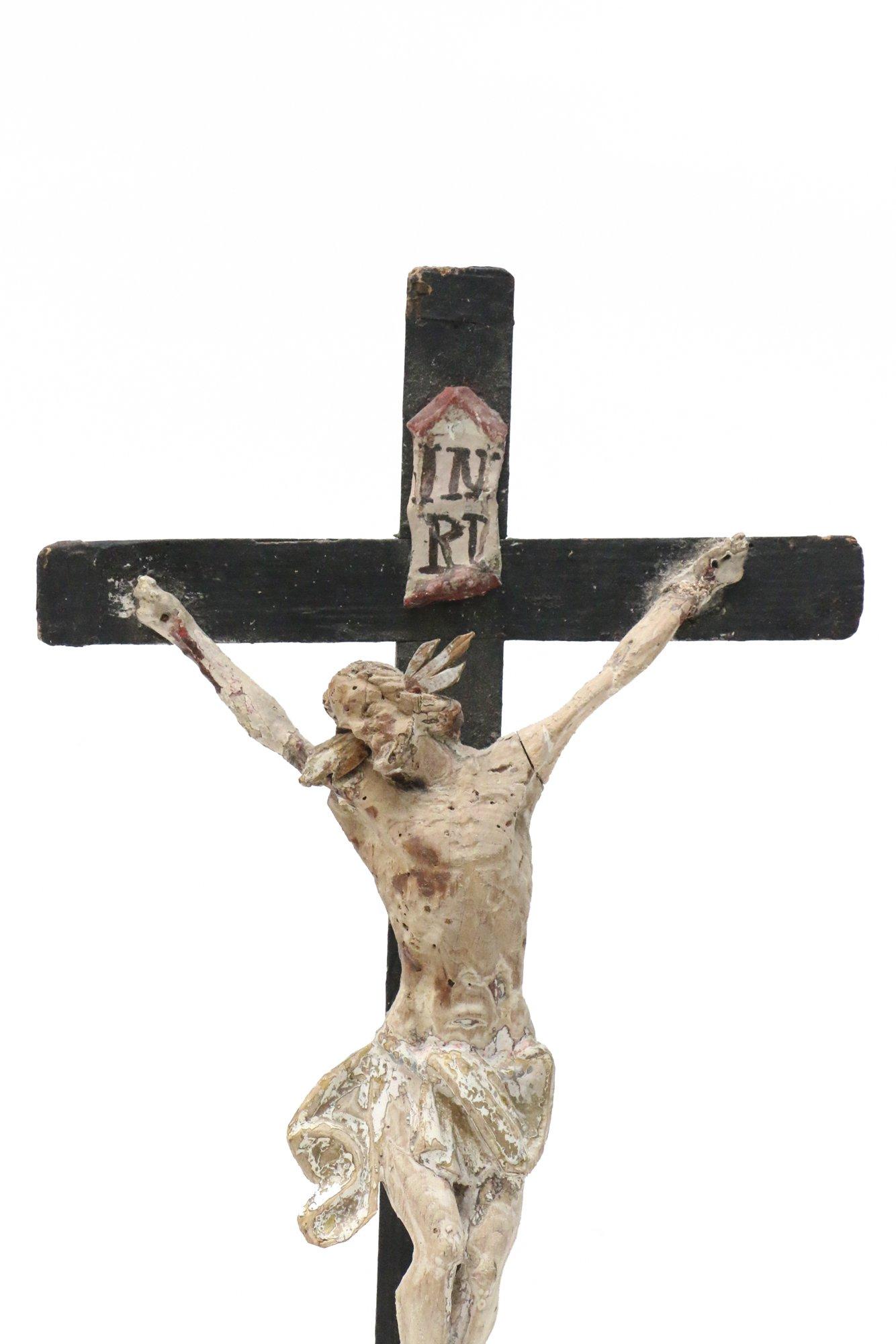 17th century Italian crucifix decorated with snowflake obsidian and fossil shells. The figure of Christ is hand carved and came from a church in Venice. The obsidian is a volcanic glass that formed as an igneous rock. It is usually black in color,