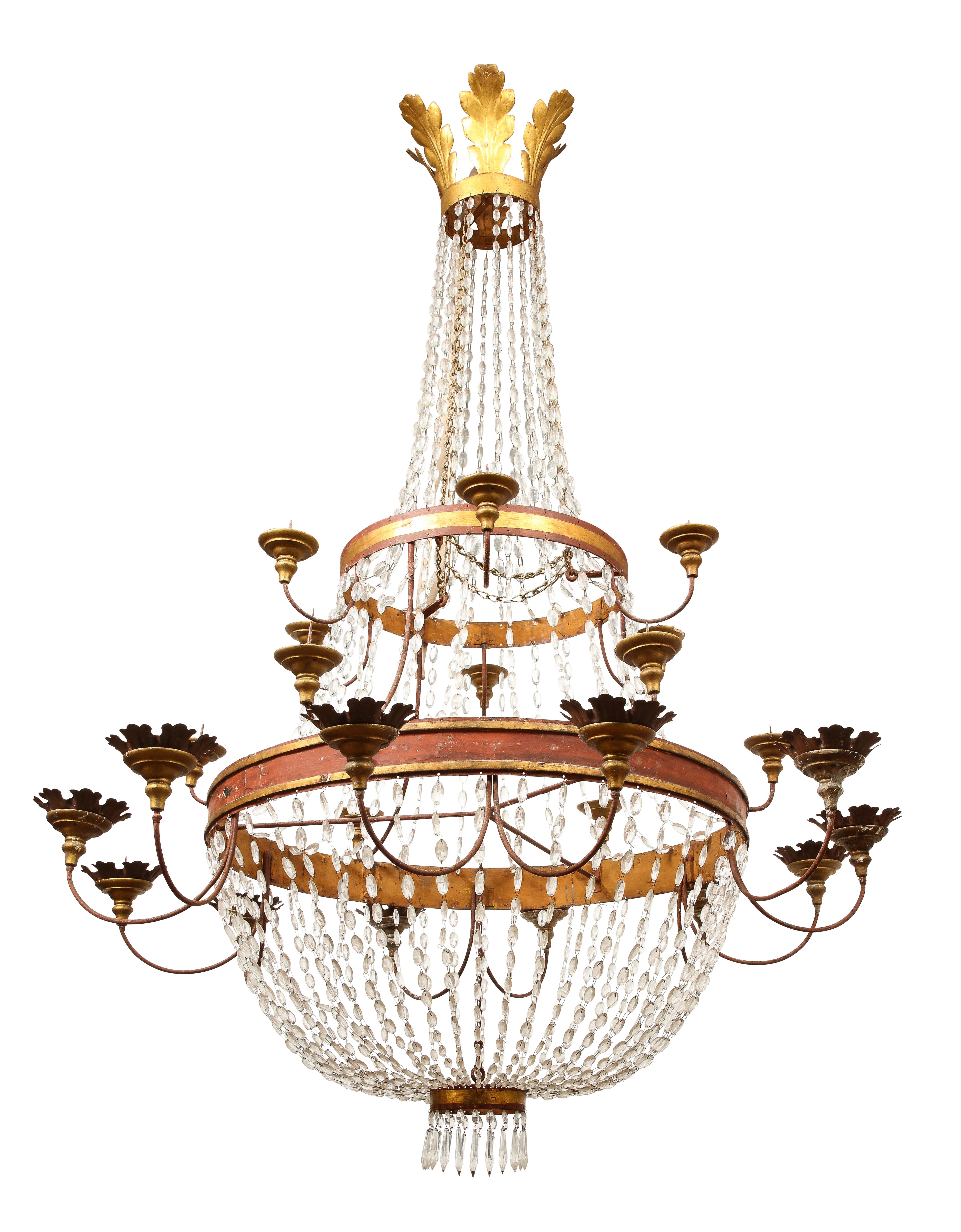 Impressive Neoclassical style 17th Century Italian crystal and gilt basket style chandelier. ***not electrified*** 

There are 25 candle stands, the bottom tier of which have ornamental leaves. Strands of crystal drape between the canopy and two