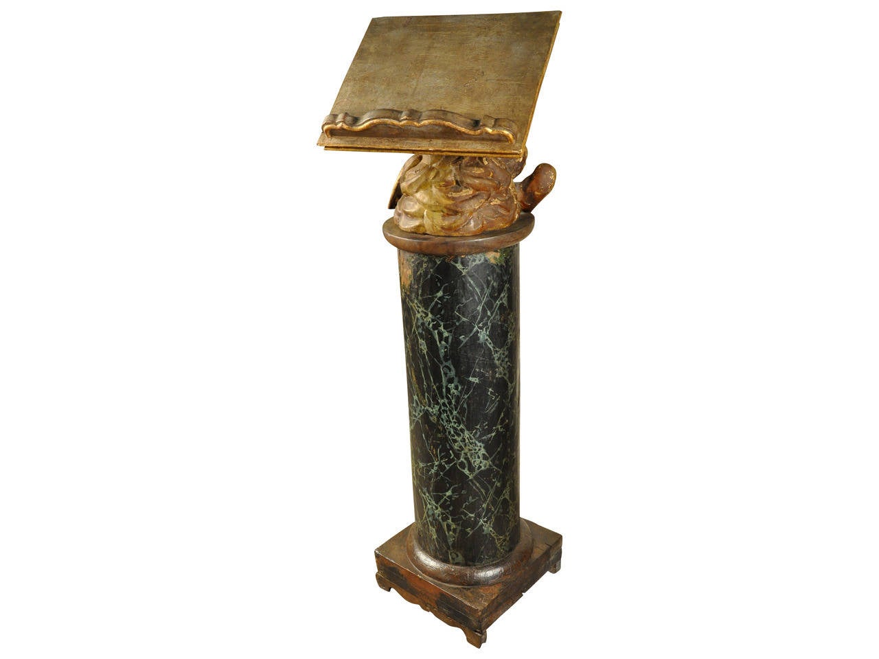 A stunning and exceptional 17th century ecclesiastical lectern from the north of Italy. The solid wood column has a polychromed faux marble finish as verde antico marble. The putti support of the book rest is in giltwood and rotates. The book rest