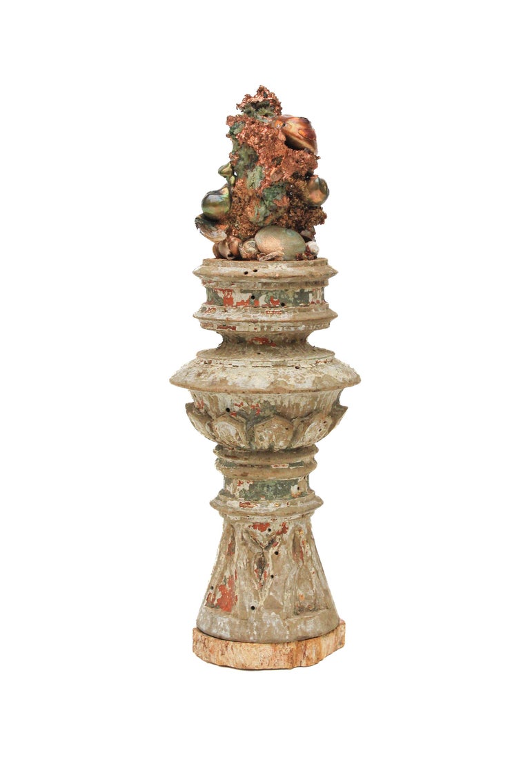 17th century Italian vase with free-forming copper, baroque pearls and shells on a petrified wood base.

This fragment is from a church in Florence. It was found and saved from the historic flooding of the Arno River in 1966.

The piece has been