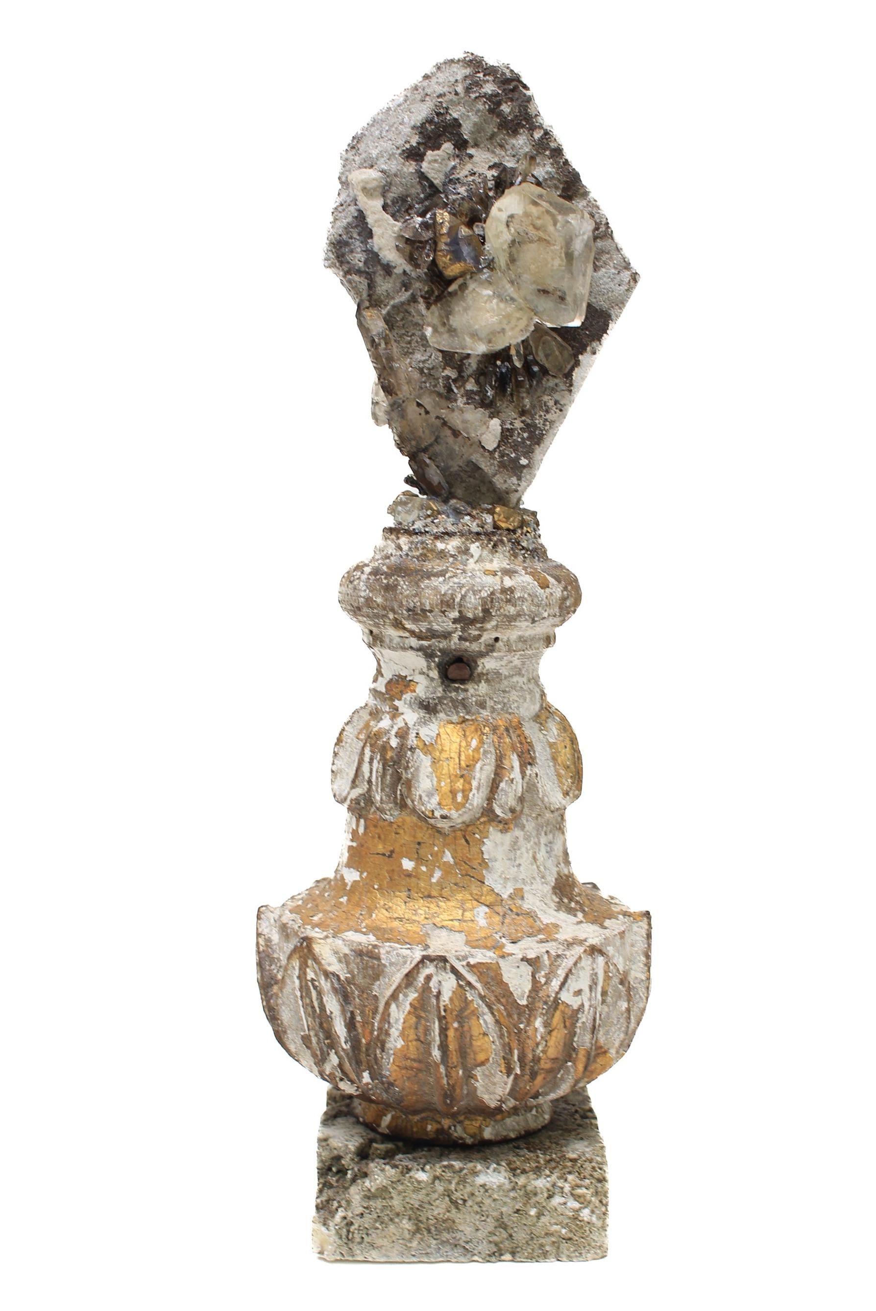 17th century Italian gold leaf fragment with calcite crystals in a rock matrix with gold leaf crystal quartz and mounted on a rock coral base.

This fragment was originally part of a candlestick from a church in Italy. The calcite crystal in matrix