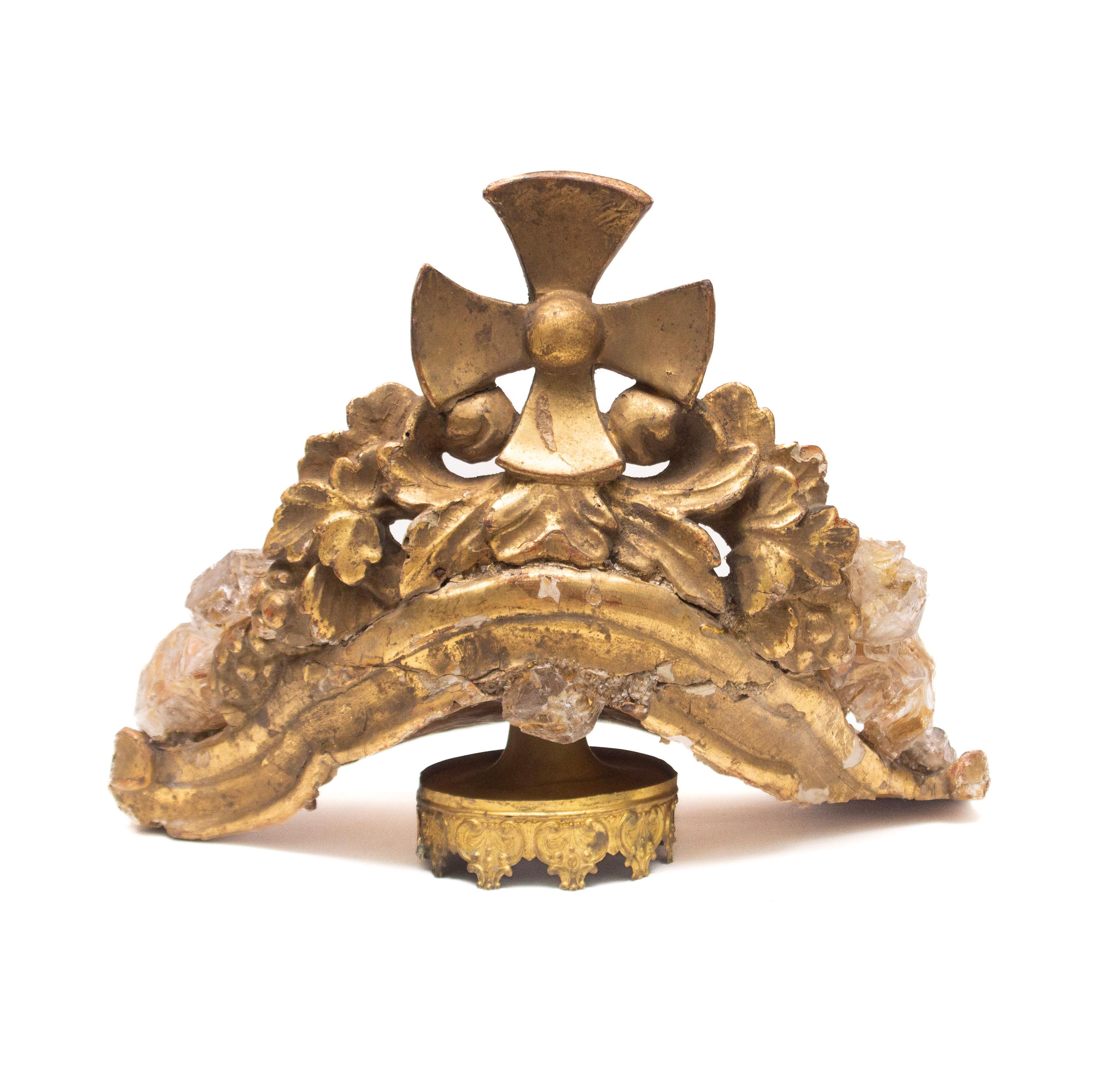 17th century Italian hand-carved and gilded crown adorned with herkimer diamonds and mounted on an antique gold base.

This was original from a historical Italian church and would have been a part of a depiction of Mary. The crown is made of