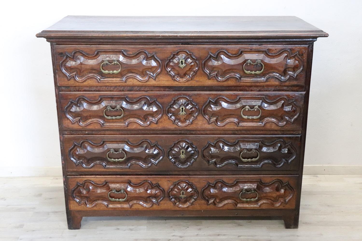 Important and rare antique Italian of the period Louis XIV chest of drawers, 1680. On the front three large and useful drawers. The first drawer has a very rare feature, the front opens to become a writing surface and internally there are eight